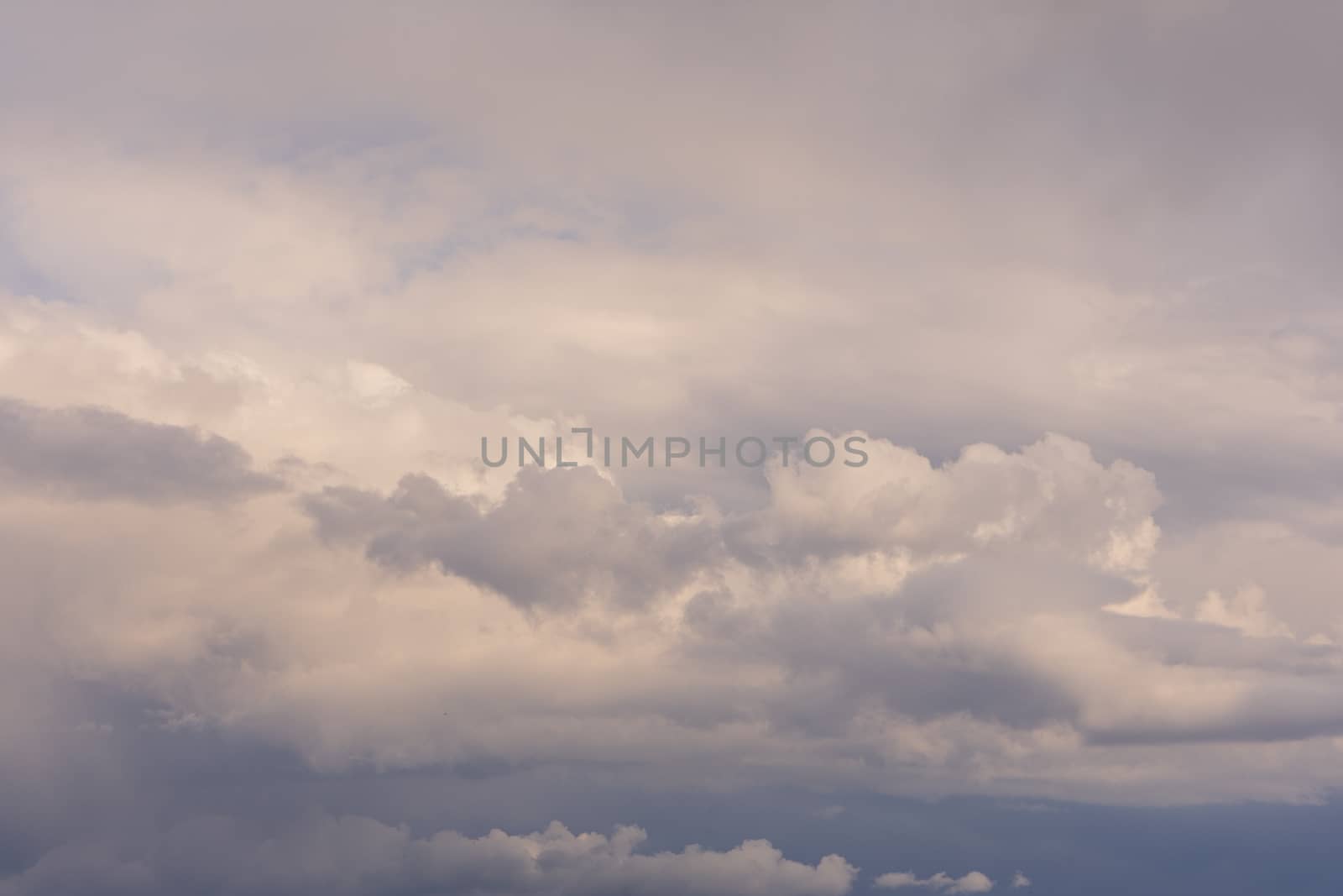 Clouds in the blue sky indicate the arrival of a disturbance, blue sky landscape