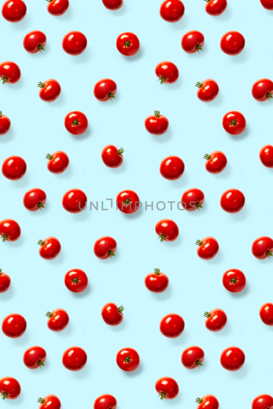 creative background from red tomatoes. Abstract background. of isolated ripe Tomato on the blue background not seamless pattern by PhotoTime