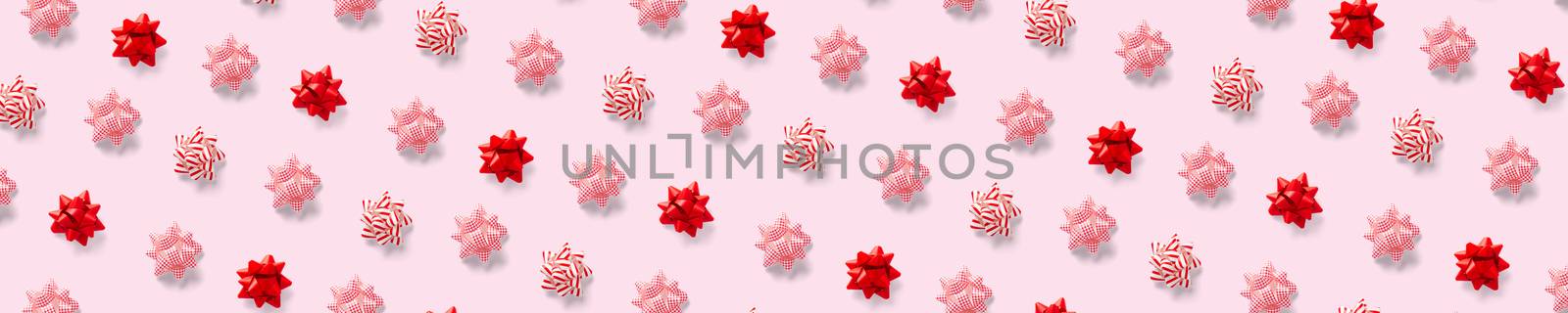 modern christmas background on pink backdrop. creative flat lay for christmas time, banners, posters, prints and other creative works. not seamless pattern