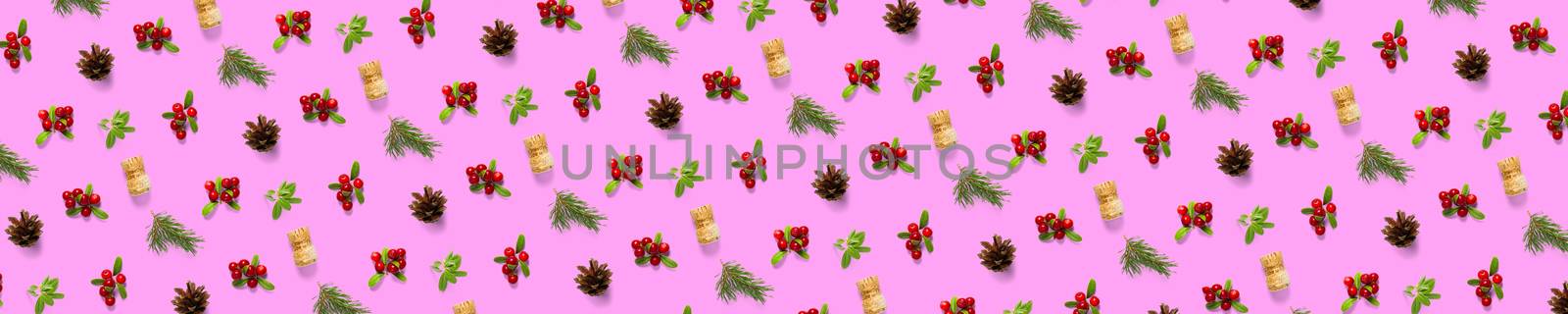christmas background with pine cone, wine cork, pine twig and lingonberry. christmas background on pink backdrop