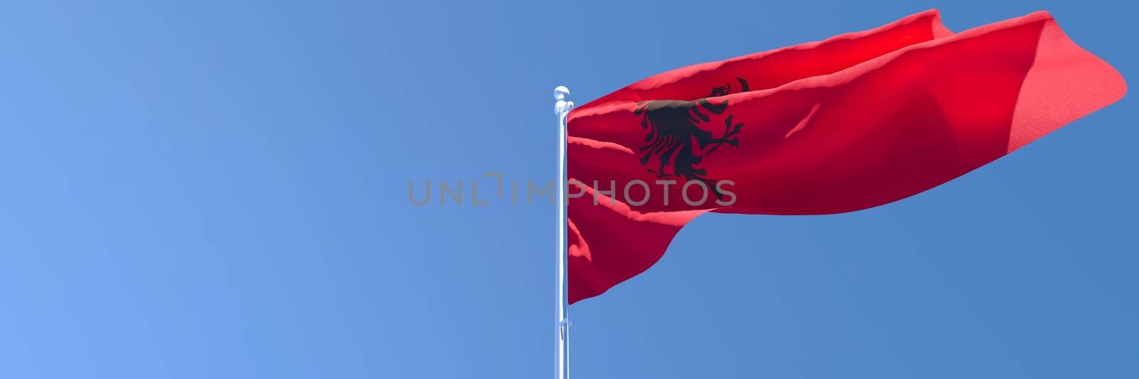 3D rendering of the national flag of Albania waving in the wind against a blue sky