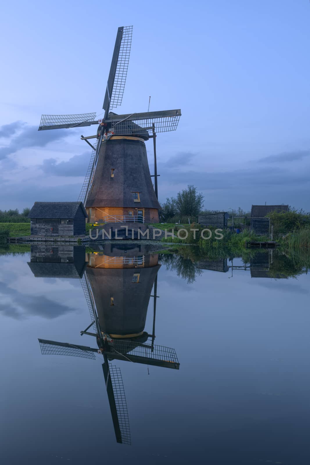Illuminated windmill at UNESCO World Heritage Site Kinderdijk, The Netherlands