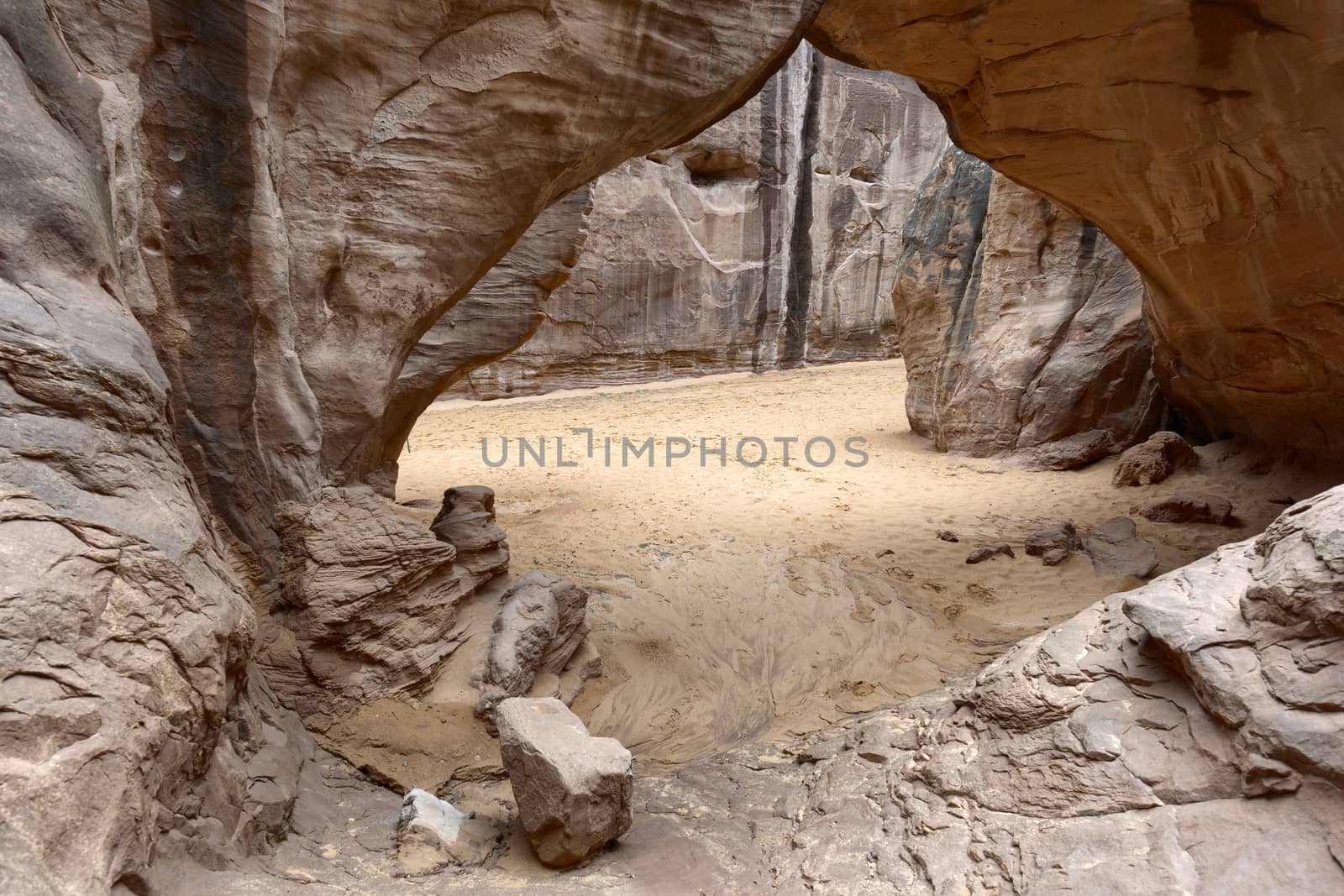 Desert view through Sand Dune Arch, Arches National Park, Utah.