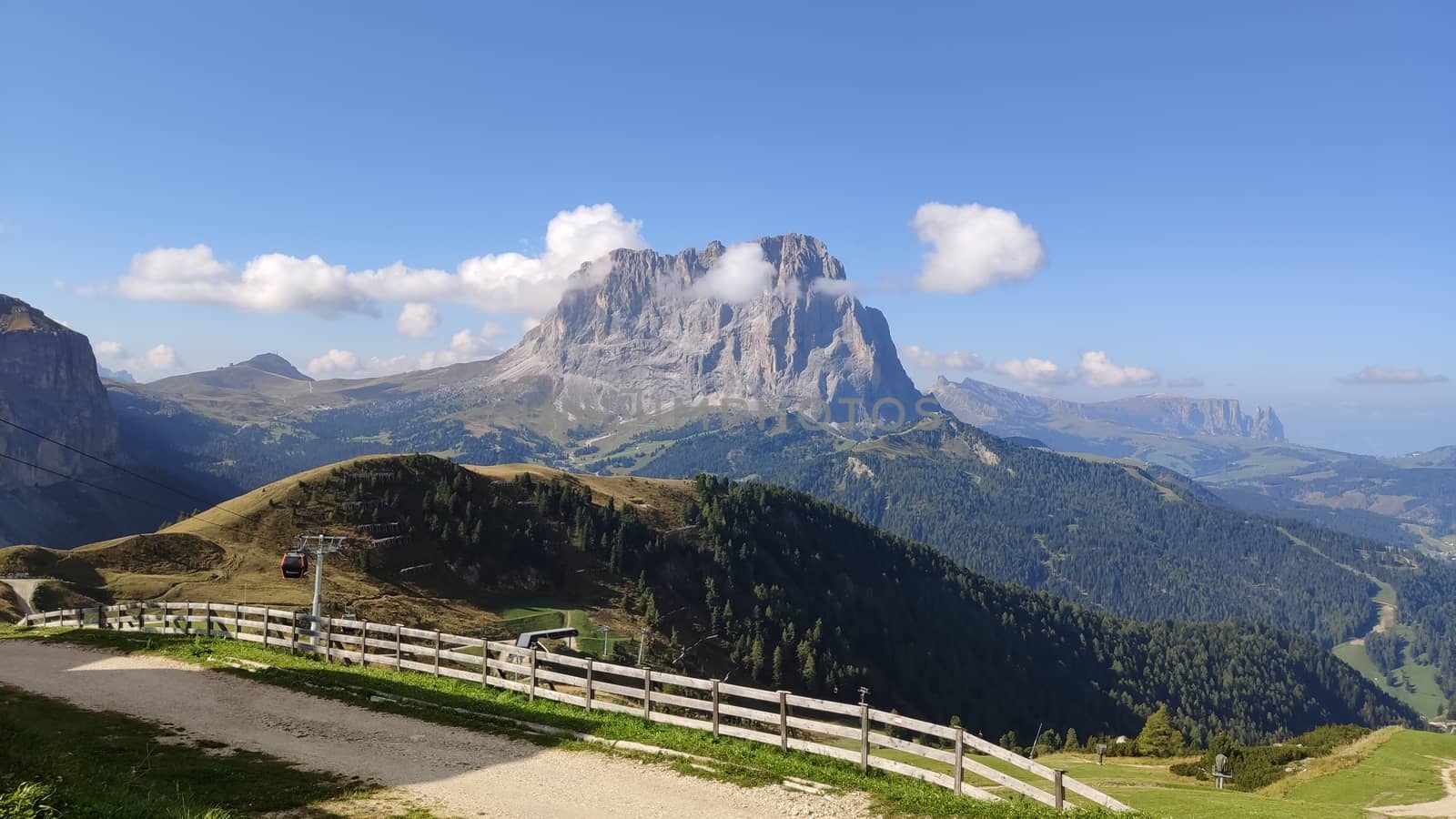 Val Gardena, Italy - 09/15/2020: Scenic alpine place with magical Dolomites mountains in background, amazing clouds and blue sky in Trentino Alto Adige region, Italy, Europe