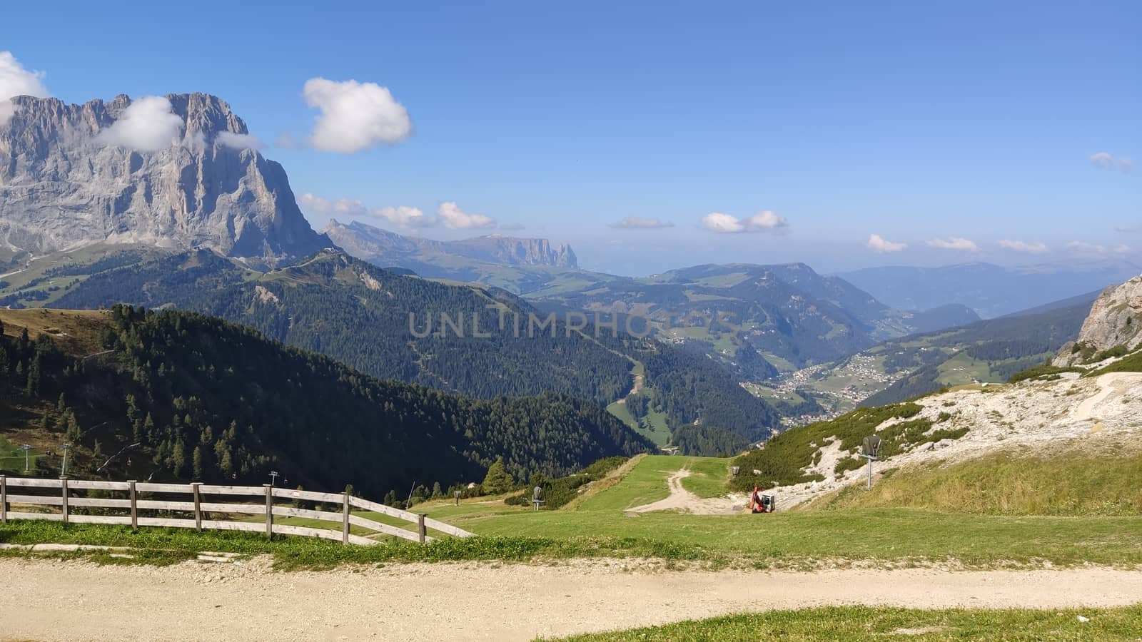 Val Gardena, Italy - 09/15/2020: Scenic alpine place with magical Dolomites mountains in background, amazing clouds and blue sky in Trentino Alto Adige region, Italy, Europe