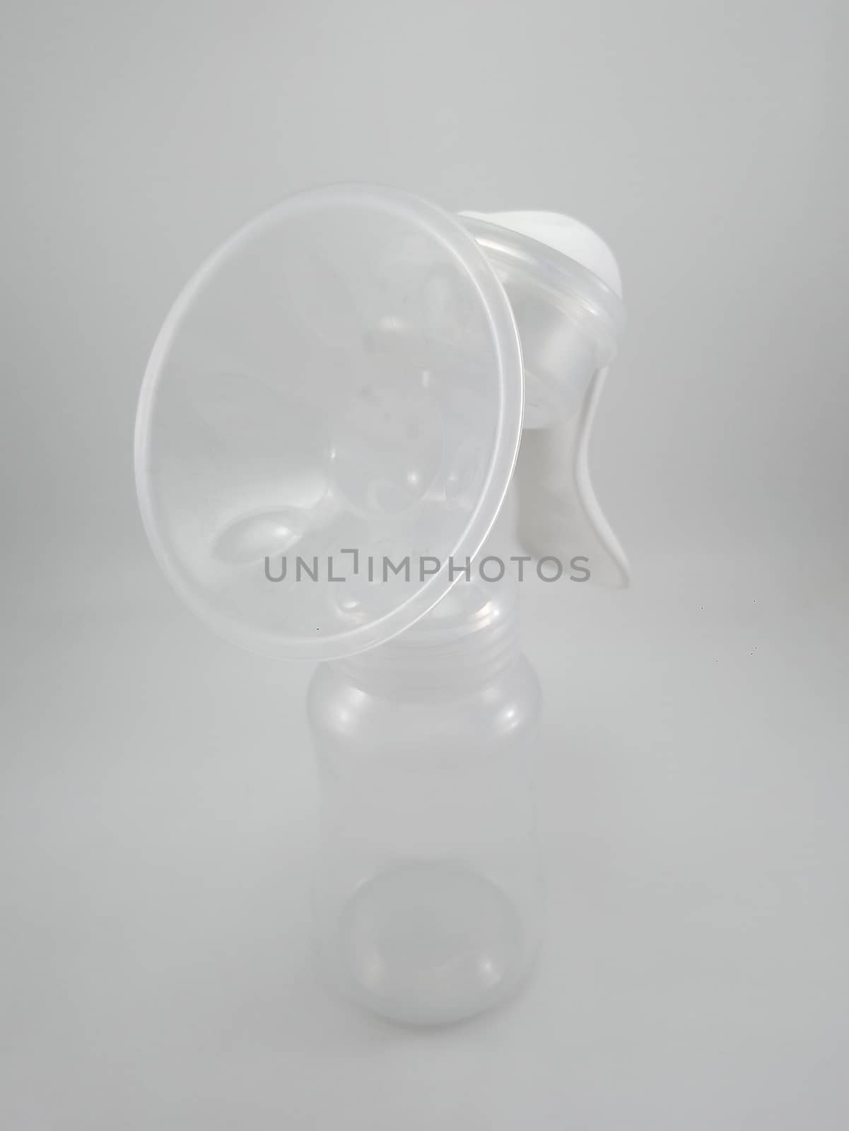 Clear plastic silicone breast pump use for lactating mother