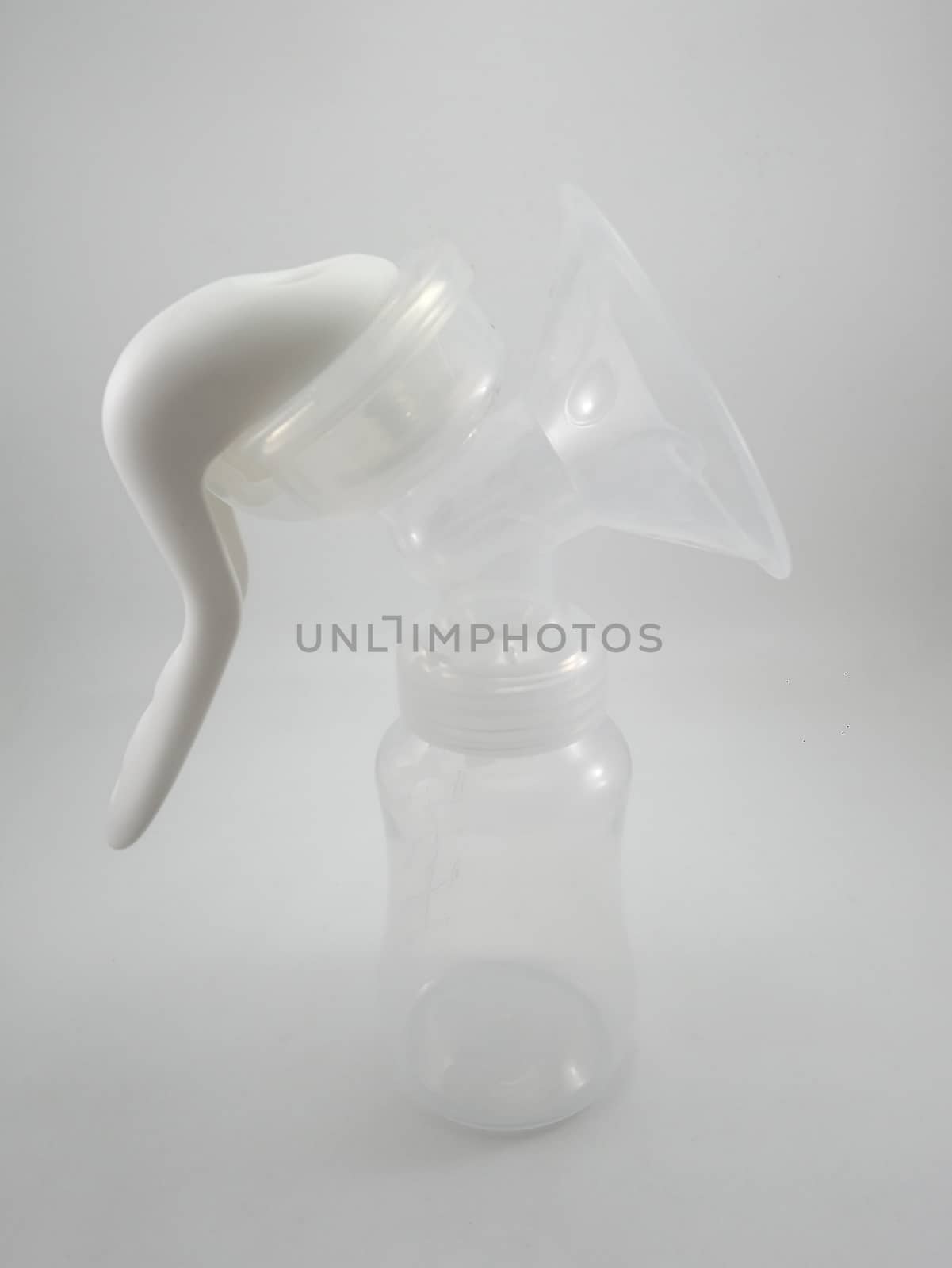 Clear plastic silicone breast pump use for lactating mother