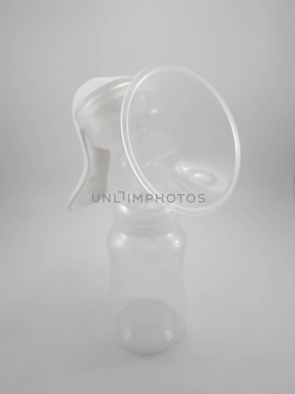 Clear plastic silicone breast pump use for lactating mother