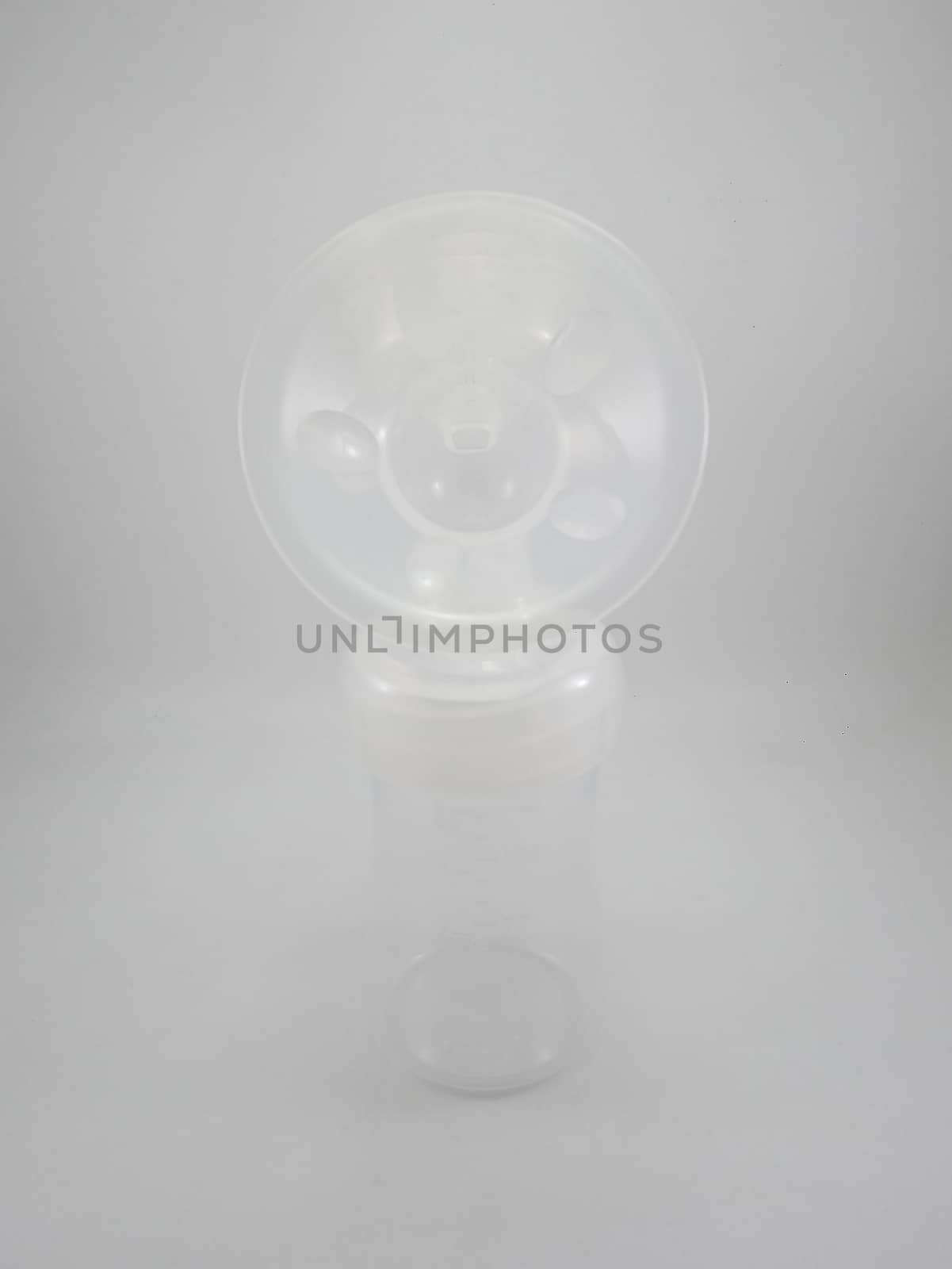 Clear plastic silicone breast pump use for lactating mother