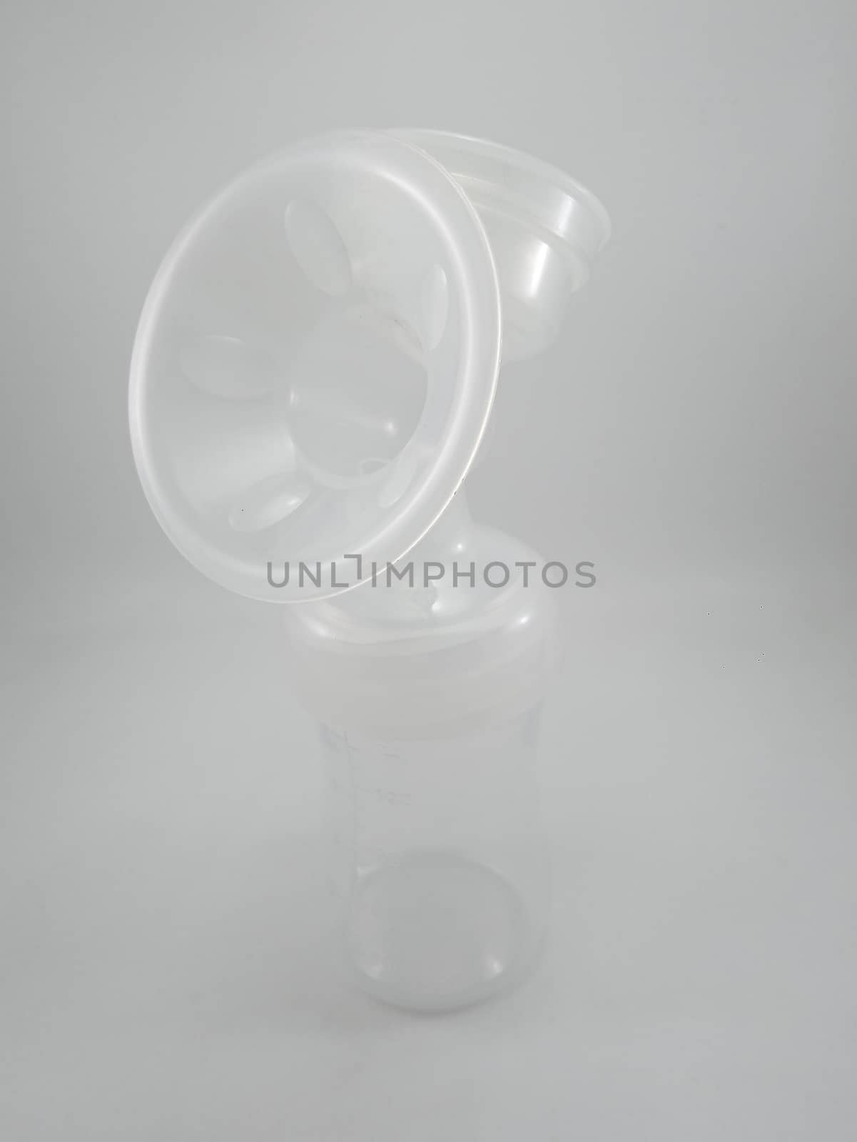 Clear plastic silicone breast pump use for lactating mother