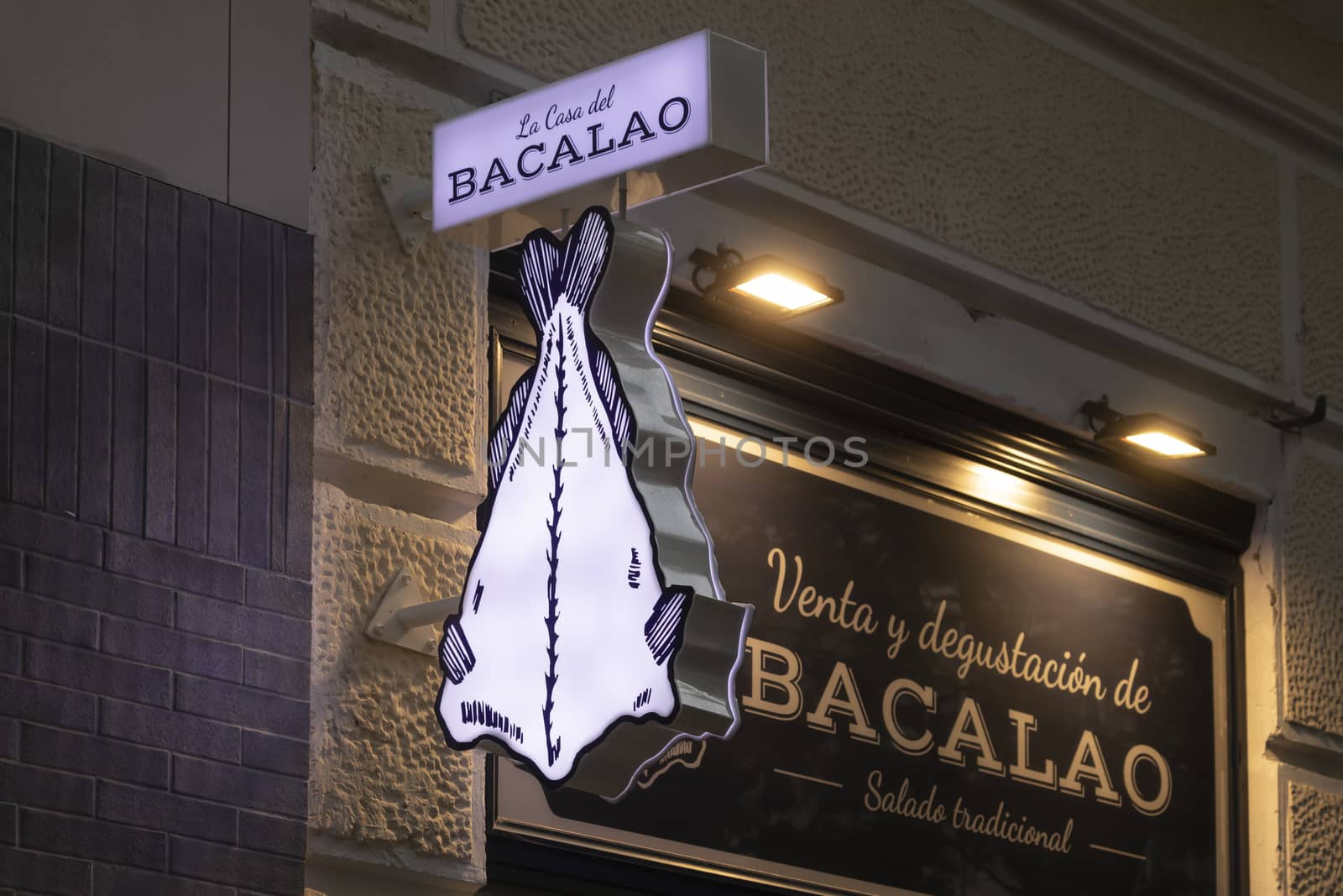 Madrid, Spain - May 19, 2020: The sign located above the entrance area to the gourmet cod shop, La Tienda del Bacalao, on Hermosilla street, in the Retiro district.