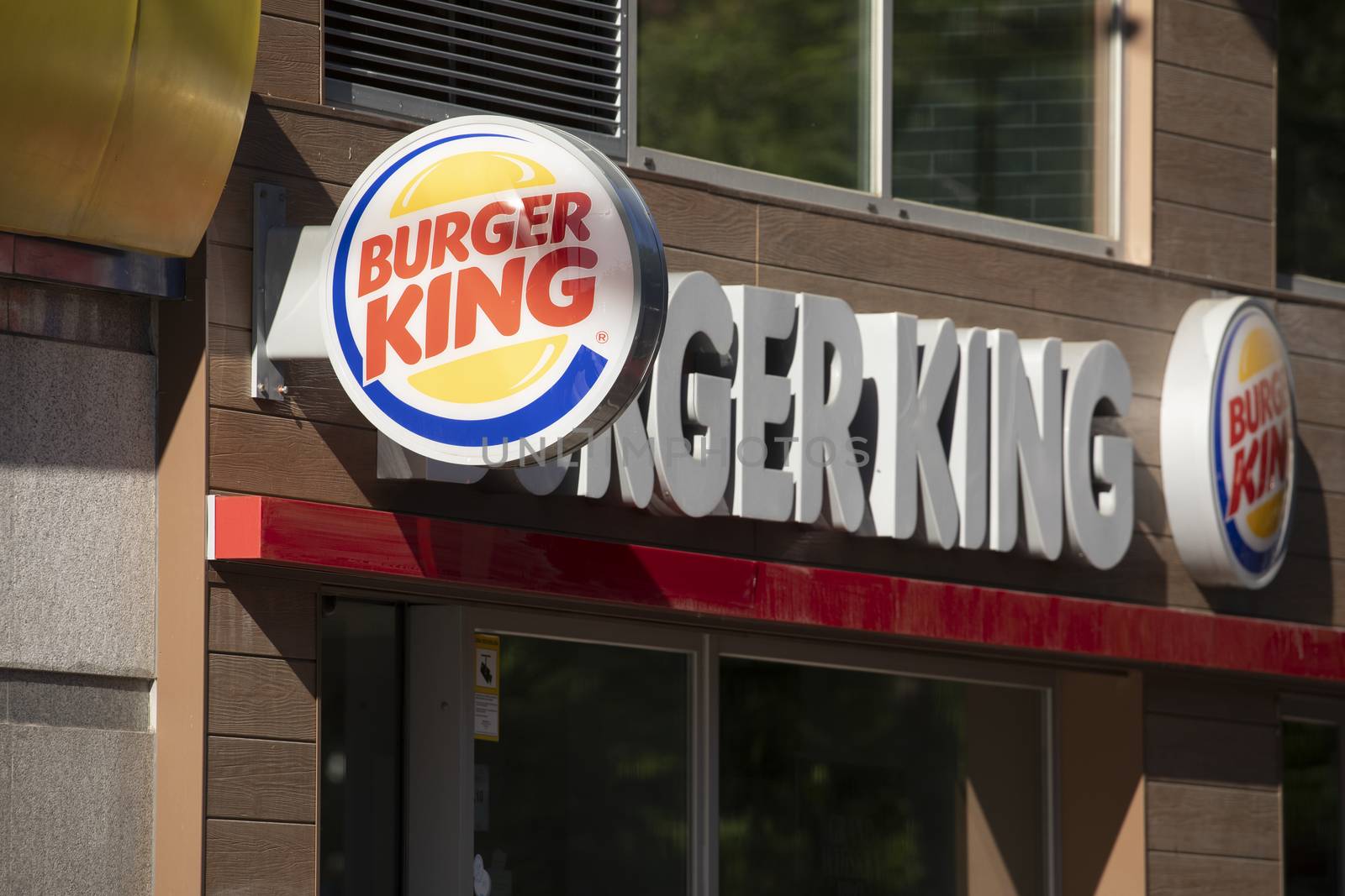 Madrid, Spain - May 18, 2020: Main access area to the fast food and hamburger restaurant, Burger King, in the Retiro district, Ibiza street.