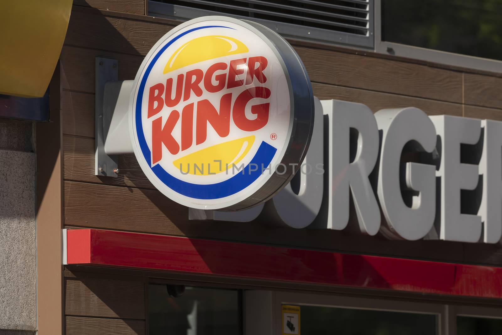 Madrid, Spain - May 18, 2020: Main access area to the fast food and hamburger restaurant, Burger King, in the Retiro district, Ibiza street.