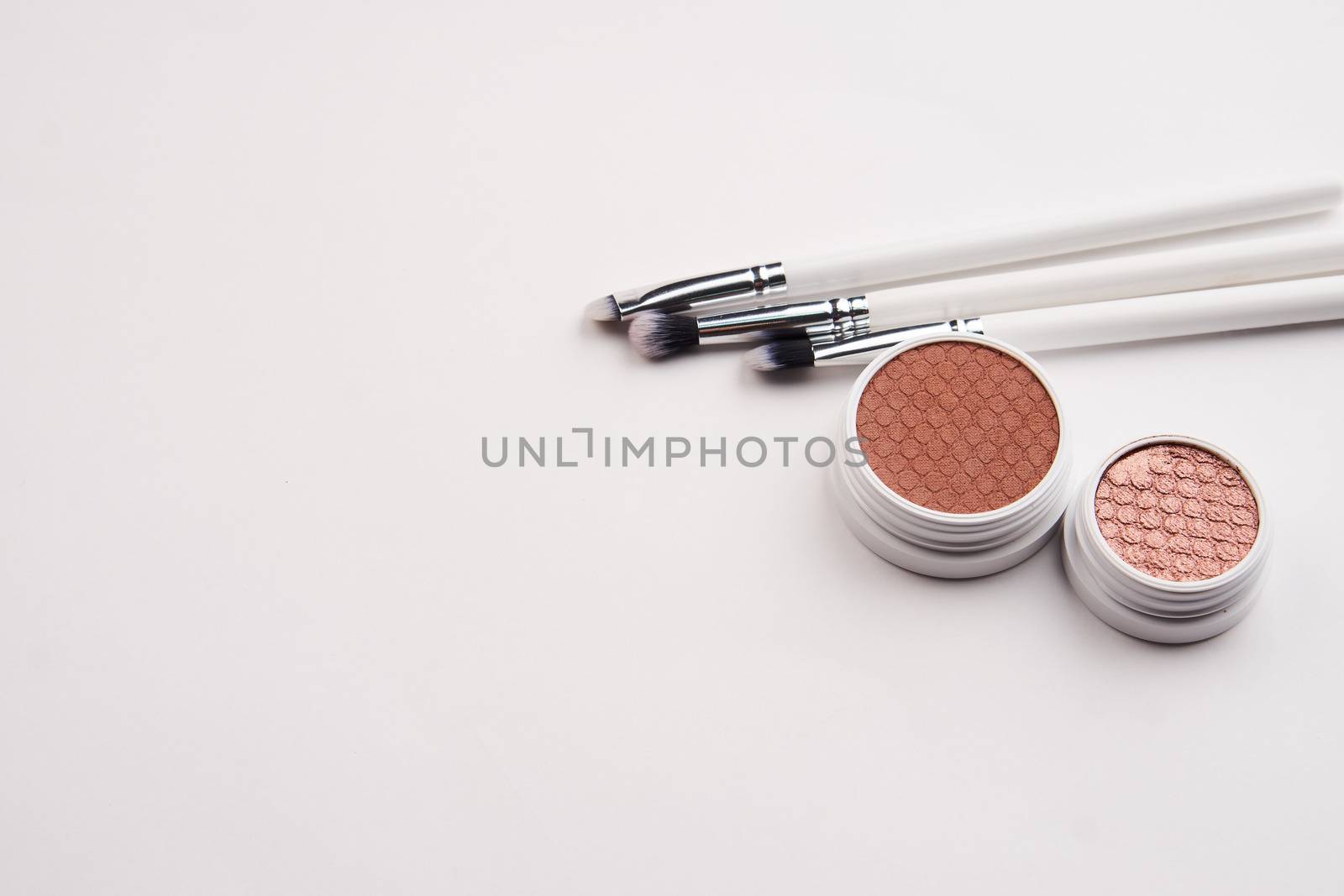 professional eyeshadow on isolated background and makeup brushes cosmetics fashion by SHOTPRIME