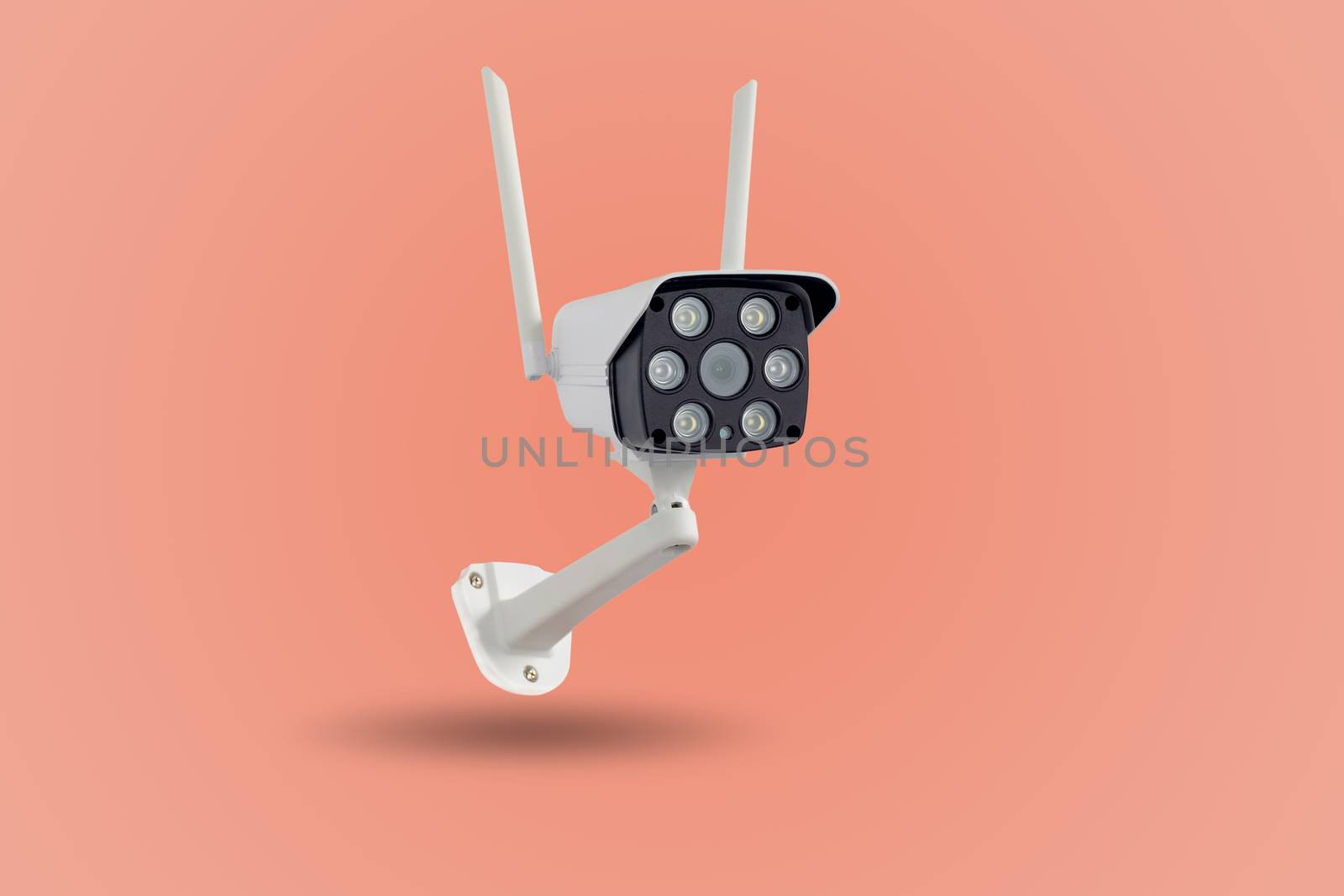 Waterproof outdoors wireless CCTV camera isolated on pastel colors background.