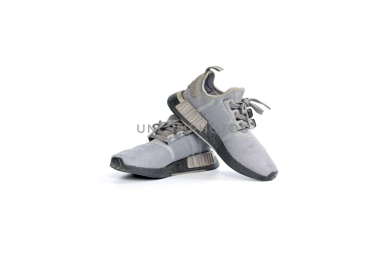 Pair of gray running shoes. by wattanaphob