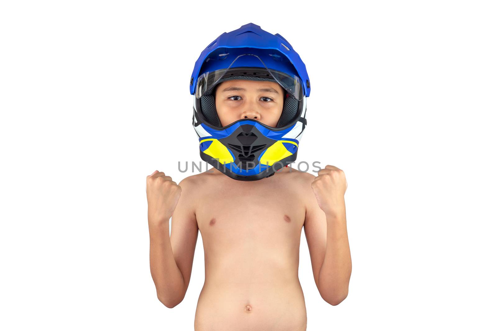 A boy wearing a motocross helmet standing but without a shirt isolated on white background.