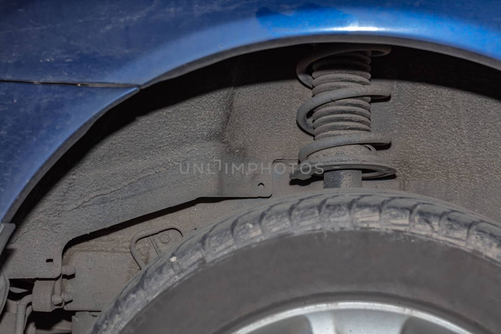 Car rack on a car close-up. Wheel tuning disk, tire are out of focus. by DamantisZ