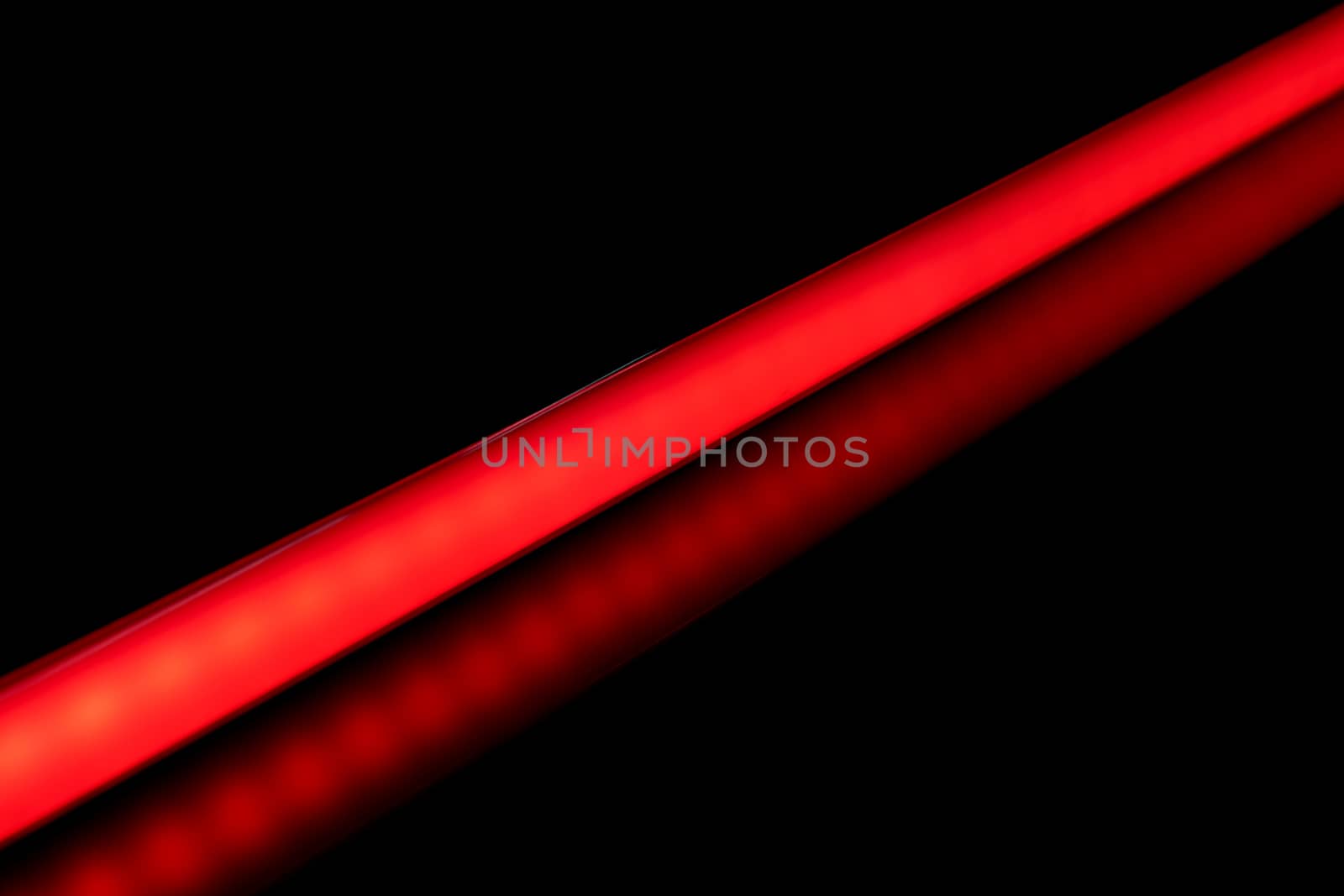 LED tube light bulb red color for photography and video on black background.