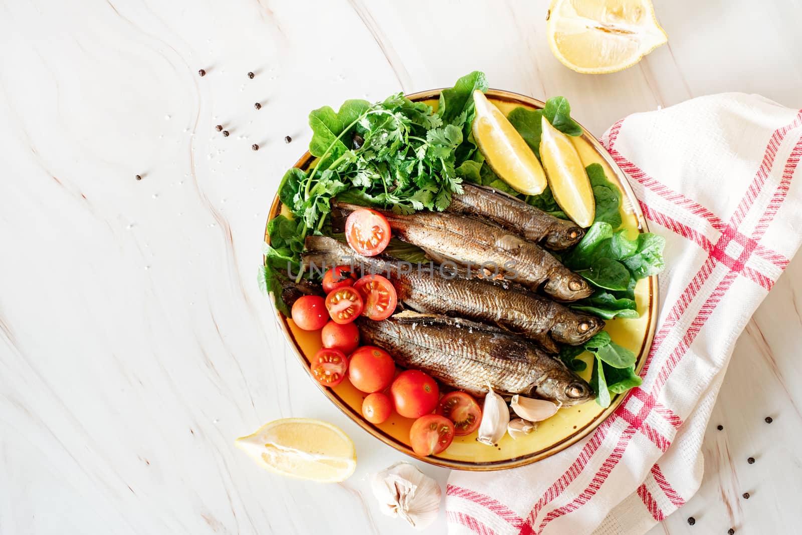 healthy eating. Plate with baked fish and fresh vegetables top view flat lay