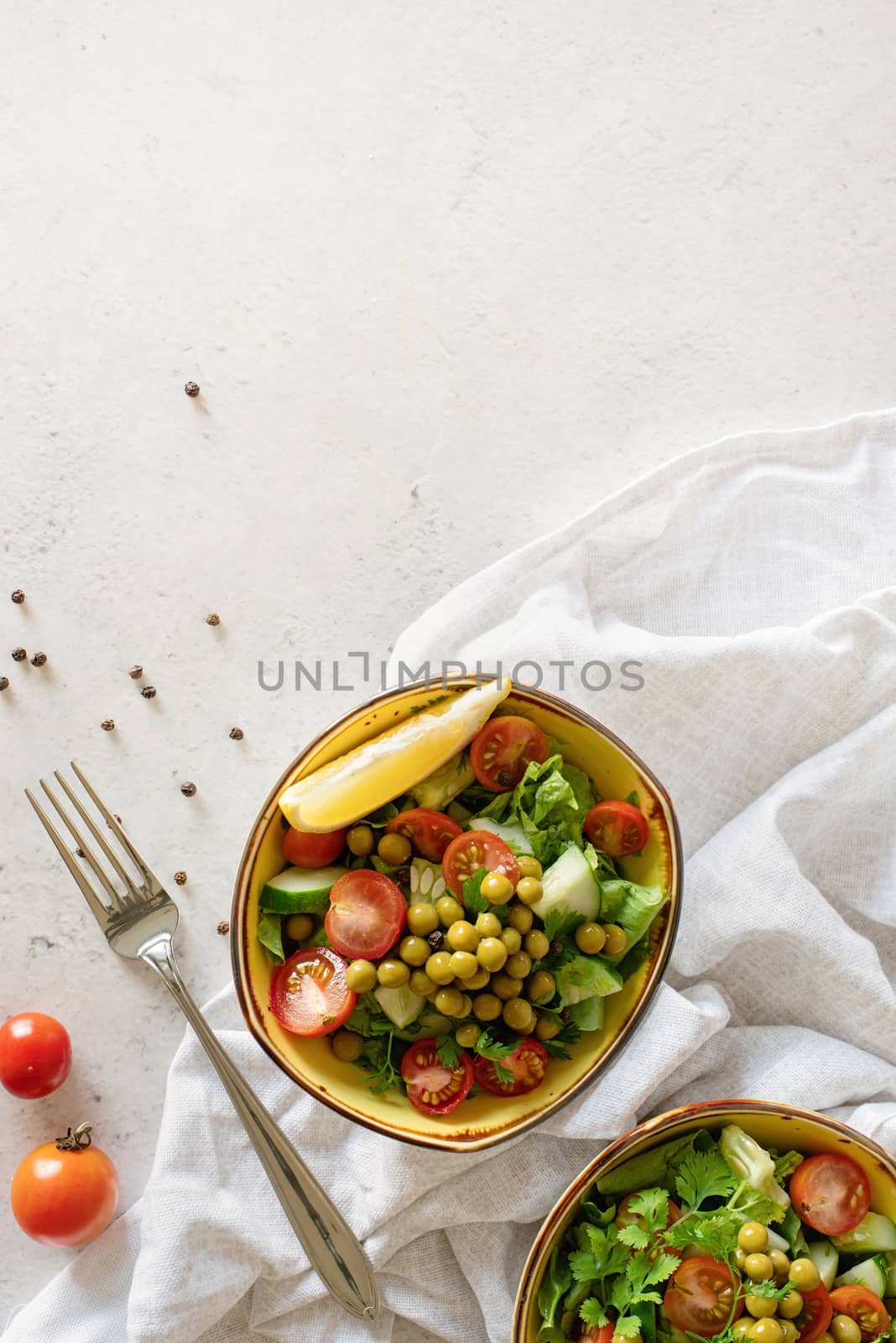 Healthy Food concept. Fresh vegetable salad in the bowl top view flat lay