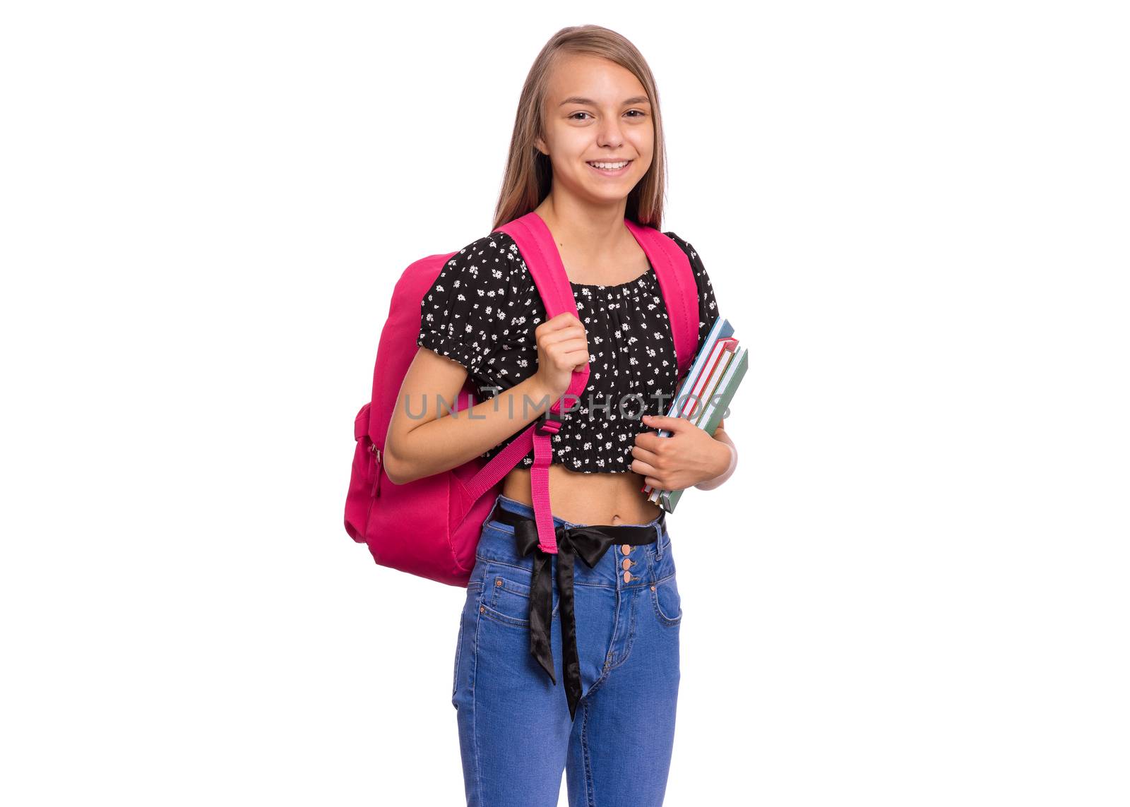 Beautiful student teen girl with backpack holding books, looking at camera. Schoolgirl with bag, isolated on white background. Child Back to school.