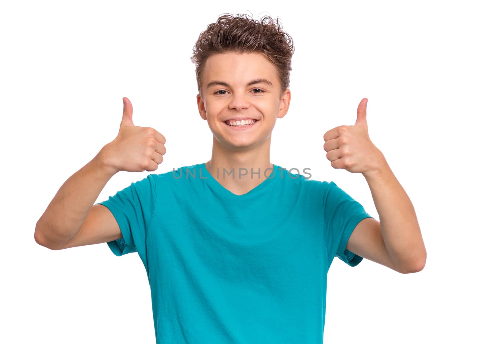 Portrait of handsome teen boy making Thumb up Gesture. Happy cute child isolated on white background.