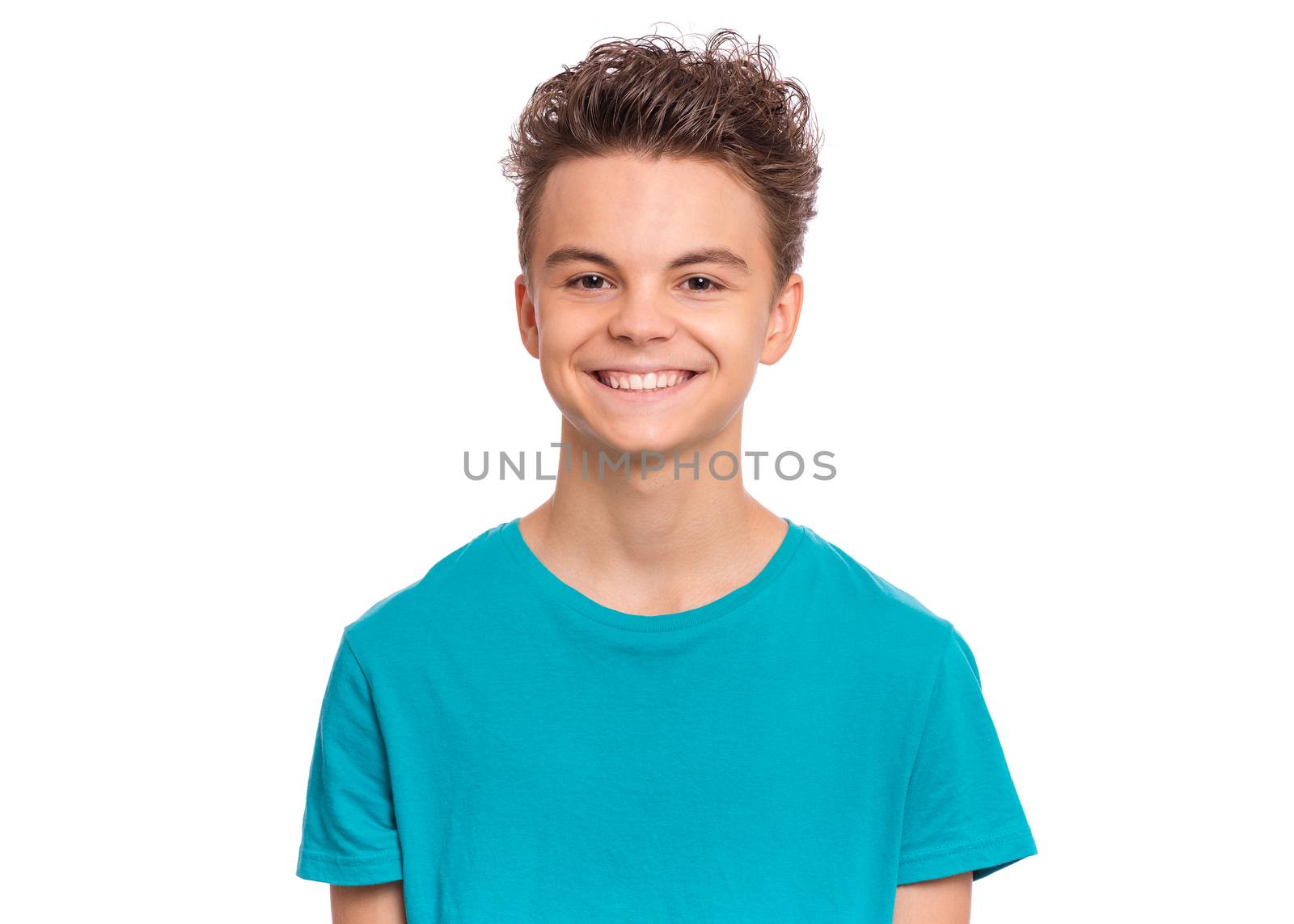 Handsome caucasian Teen Boy in blue t-shirt, isolated on white background. Teenager looking at camera and smiling. Happy child - close-up portrait.