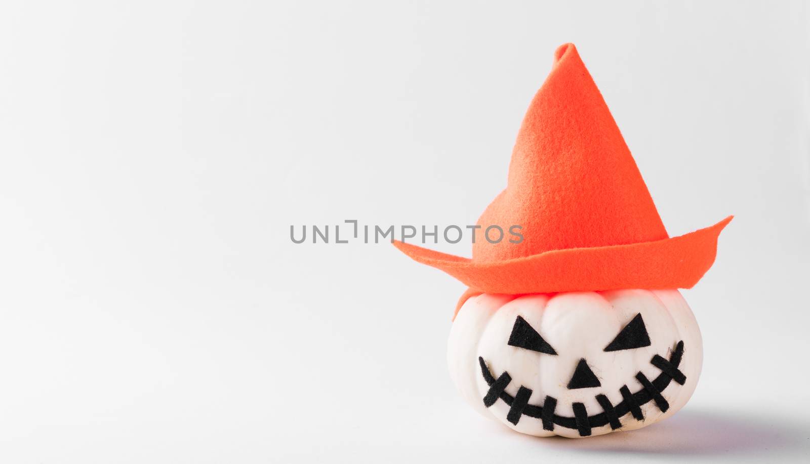 Funny Halloween day party concept ghost pumpkin head jack lantern scary smile wear hat, studio shot isolated on white background, Holiday decoration