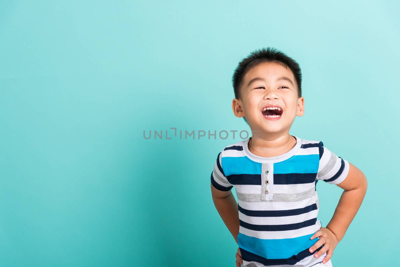 Asian portrait of cute little boy kid happy face he laughing smi by Sorapop