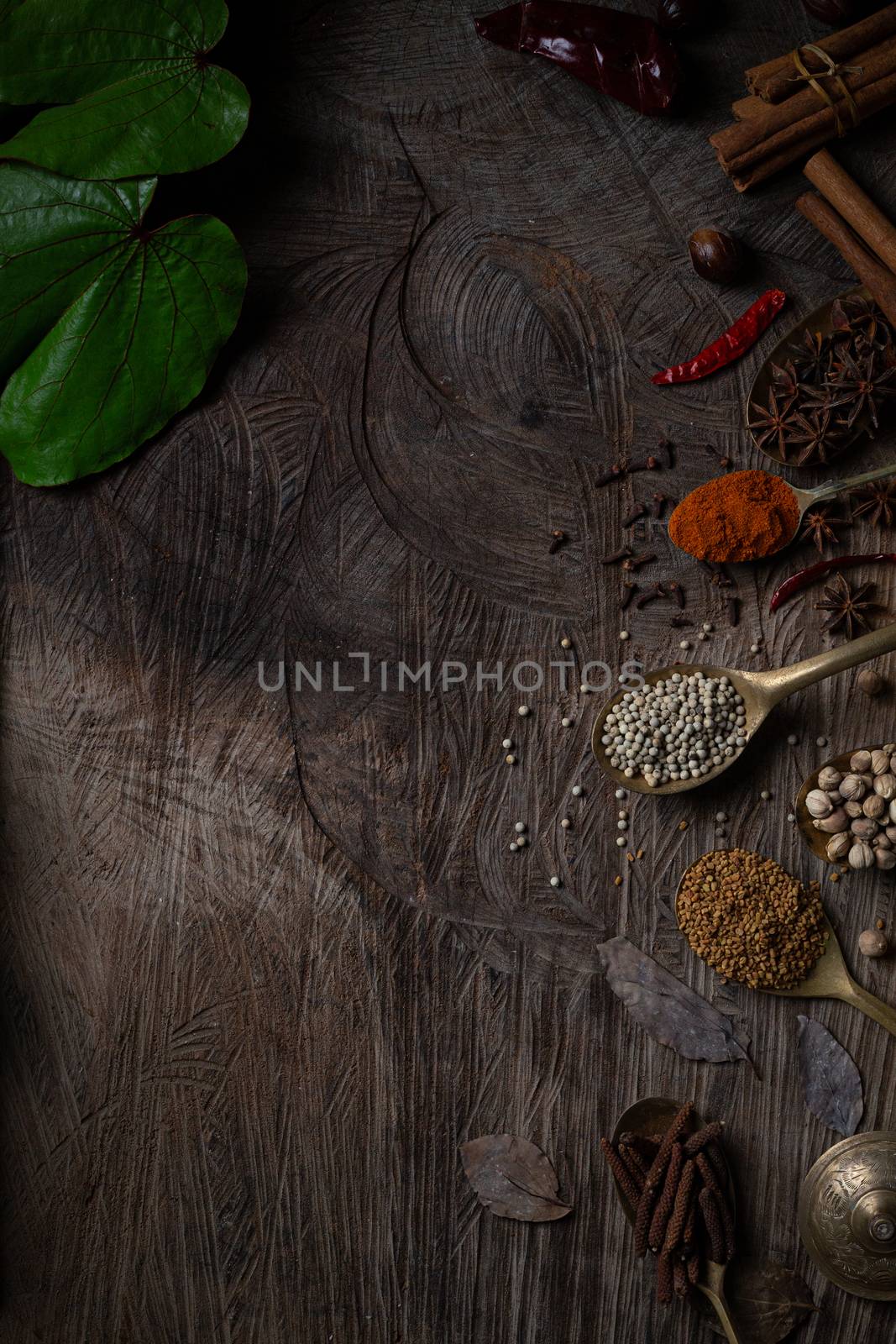Condiment of indian food Spice garnish background on wood table  by golfmhee