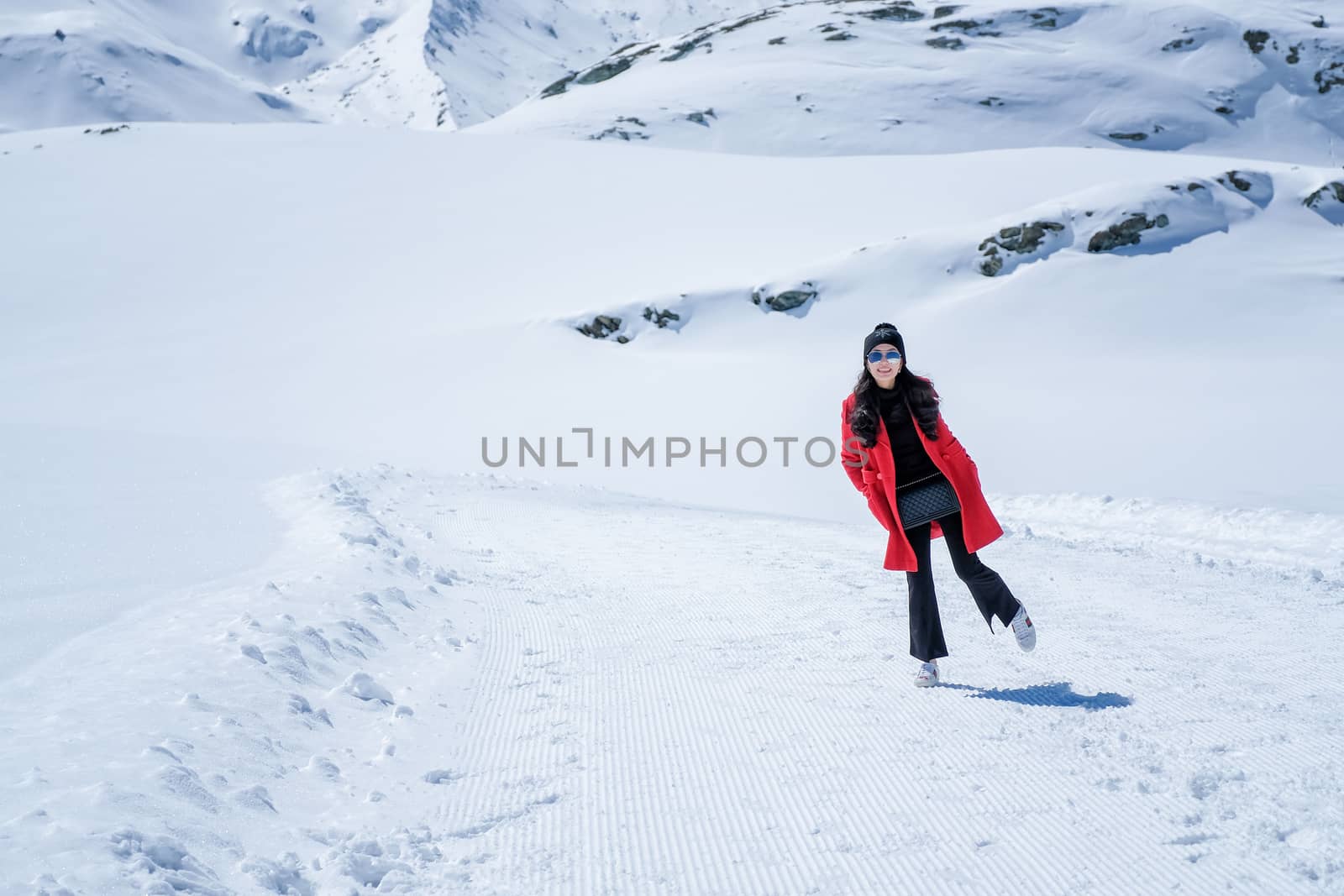 Young Woman Tourists see beautiful view of snow mountain Matterh by Surasak