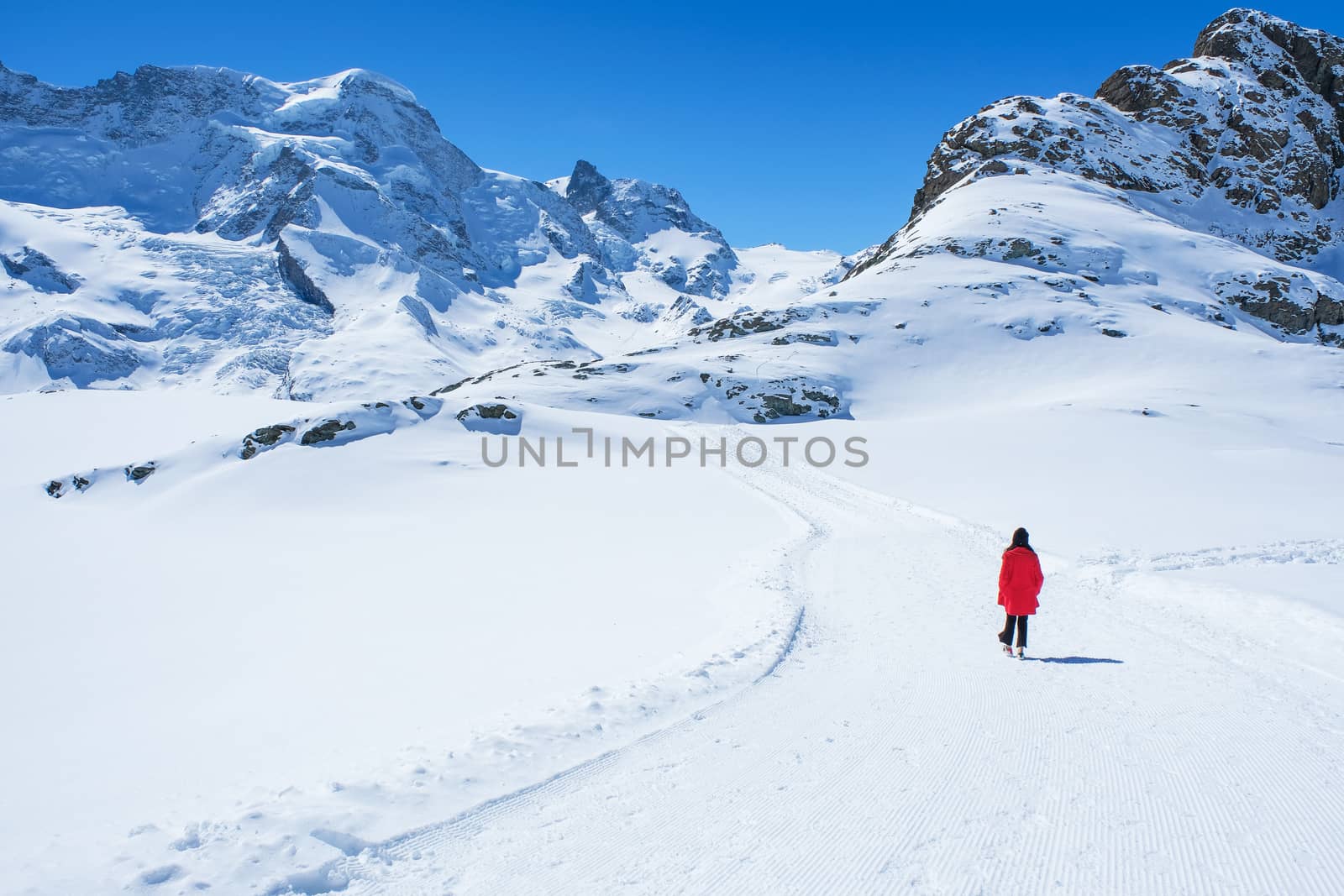Young Woman Tourists see beautiful view of snow mountain Matterh by Surasak