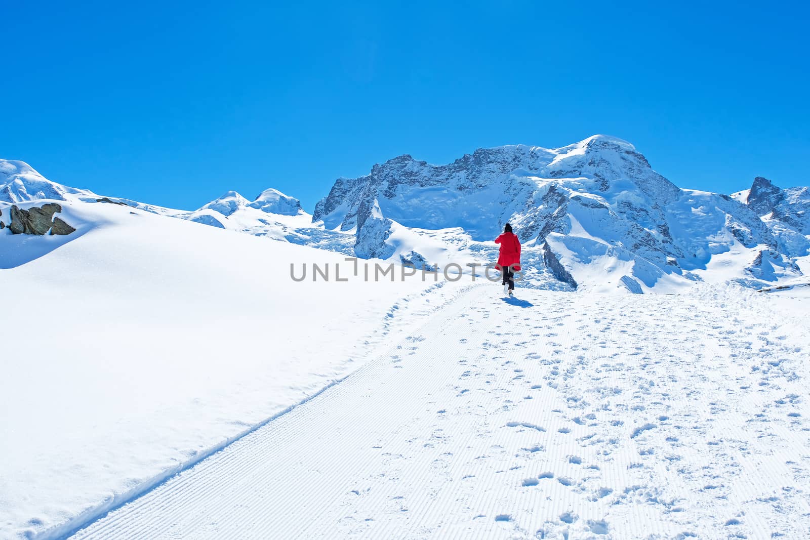 Young Woman Tourists see beautiful view of snow mountain Matterh by Surasak