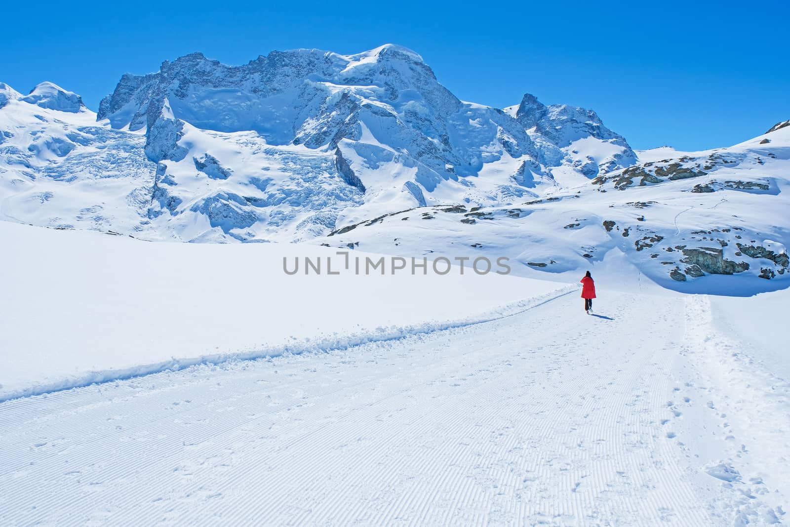 Young Woman Tourists see beautiful view of snow mountain Matterh by Surasak