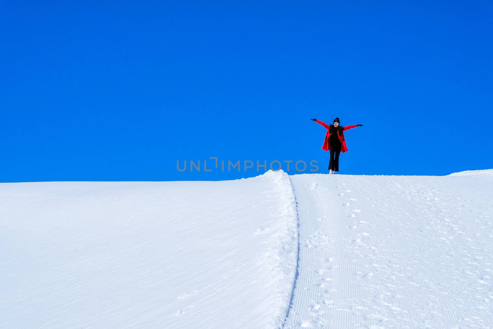 Young Woman Tourist walking in snow mountain Matterhorn peak, Ze by Surasak
