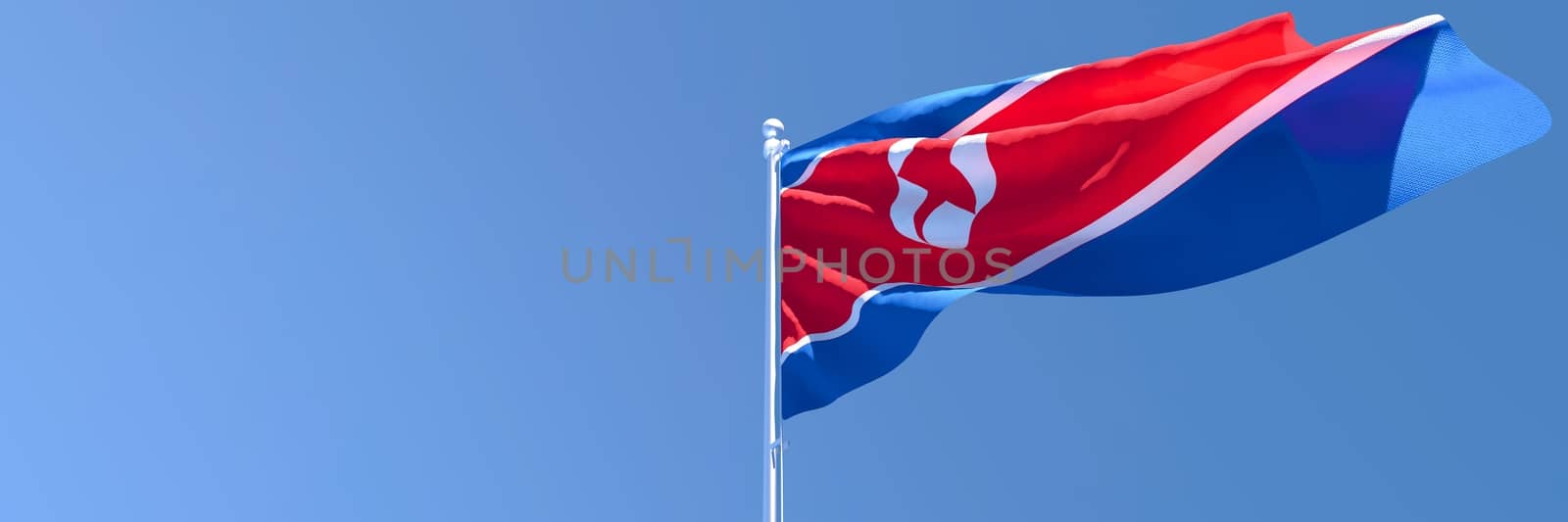 3D rendering of the national flag of North Korea waving in the wind against a blue sky