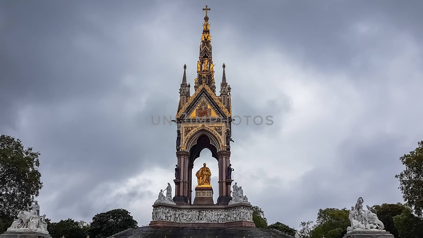 London, UK - July 8, 2020: The Prince Albert memorial in Hyde park. Dark cloudy sky as a background.