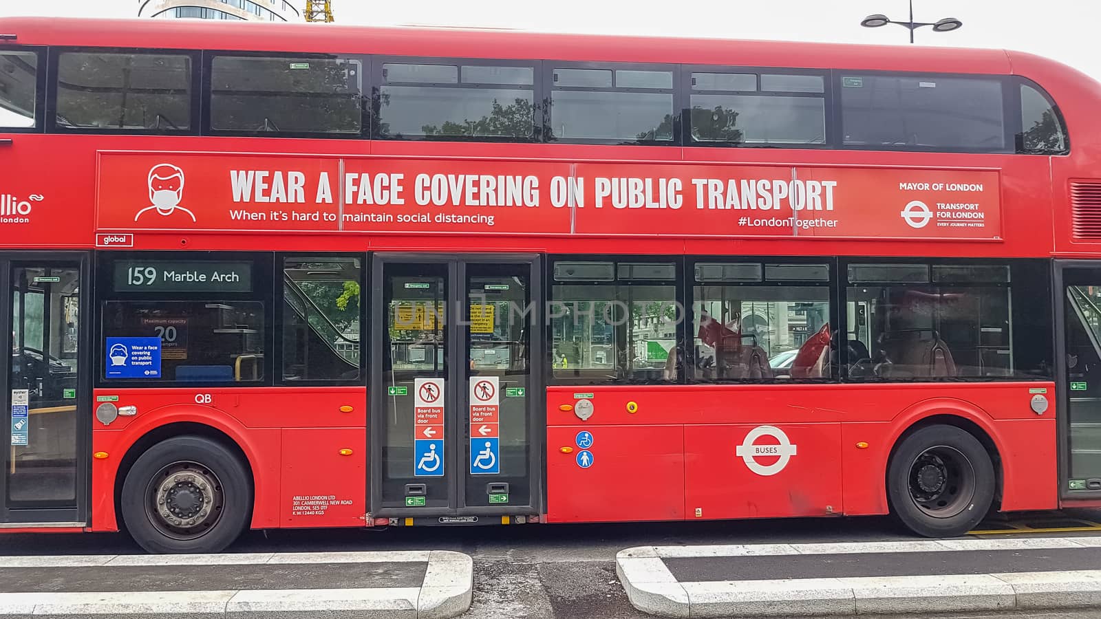 London, UK - July 8, 2020: Modern red double-decker bus is waiting for people in central London by DamantisZ