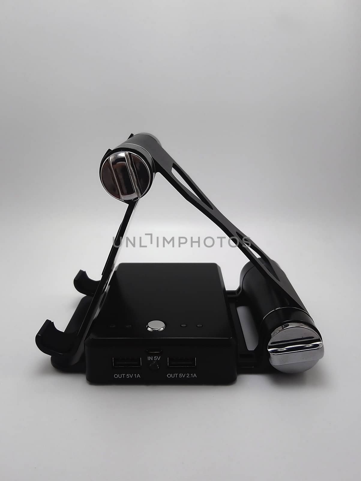 Foldable inclined stand powerbank charger use to charge low to empty battery of smartphone