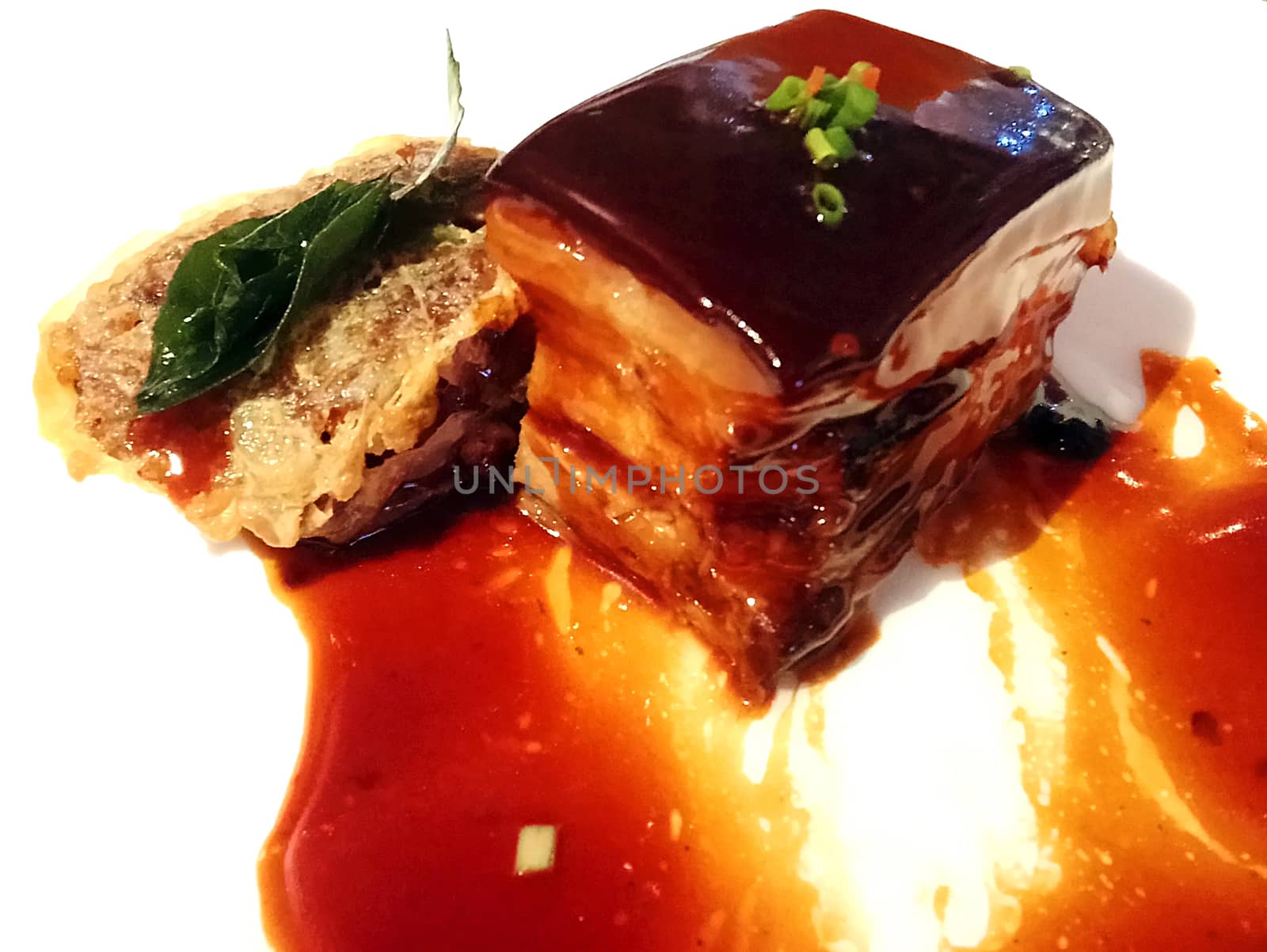 Juicy pork belly on white plate by imwaltersy