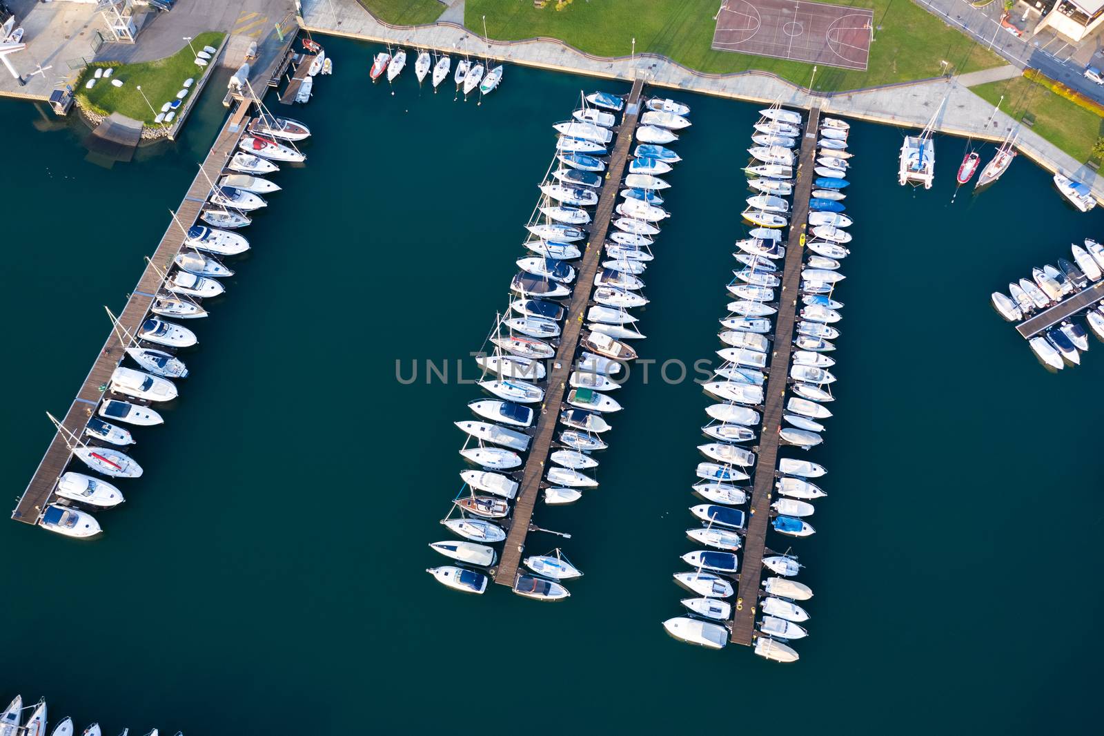 Aerial bird eye view of sailboats and yachts moored in Lovere port, Iseo lake near Bergamo,Italy.