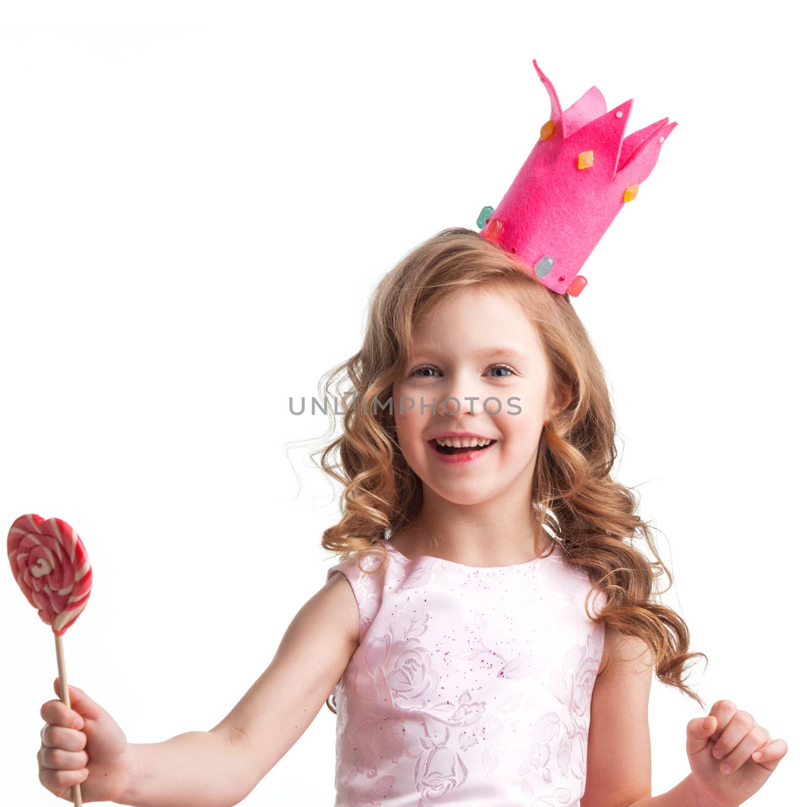 Beautiful little candy princess girl in crown with big pink heart lollipop