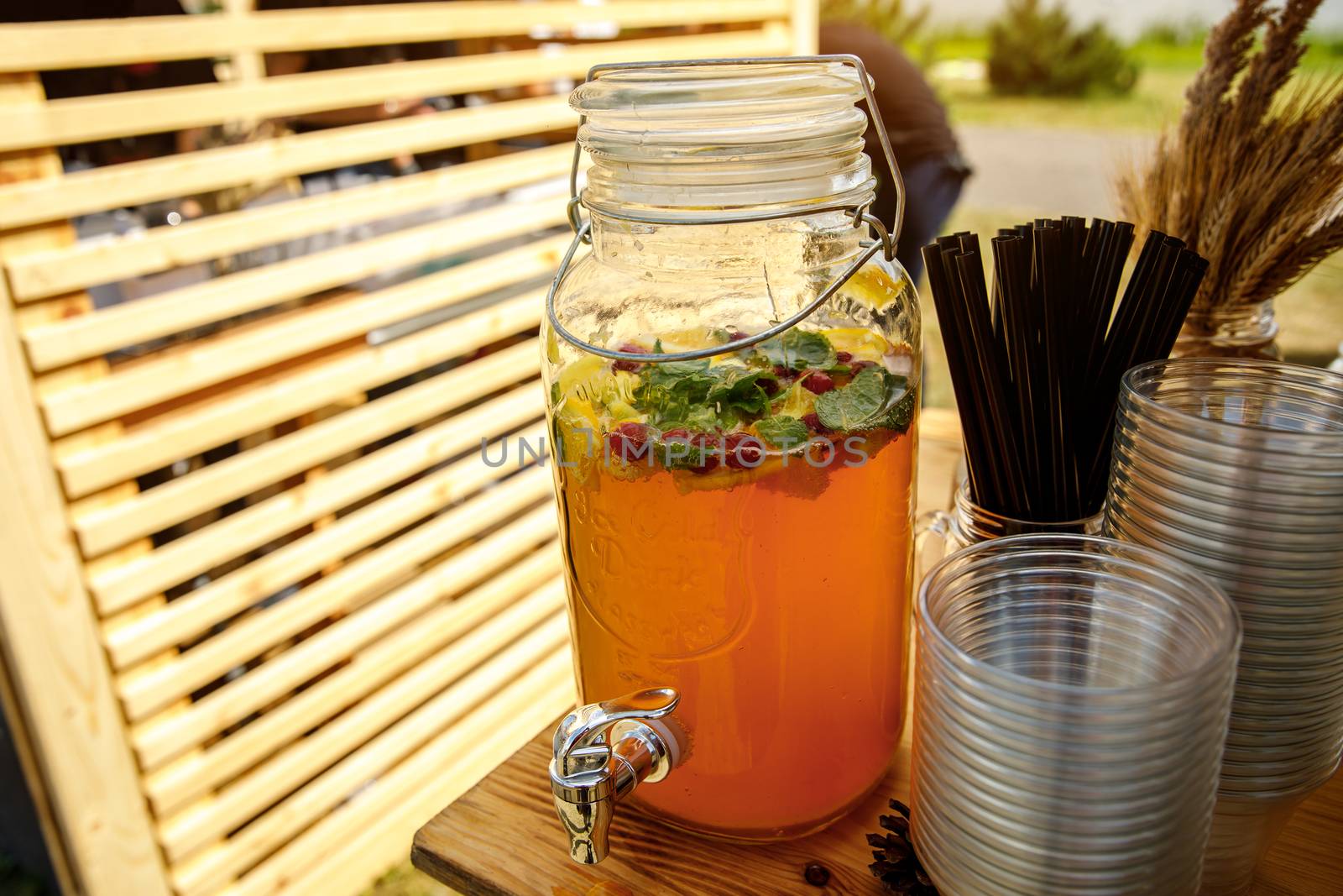 Jugs of lemonade at the summer outdoor party. by 9parusnikov