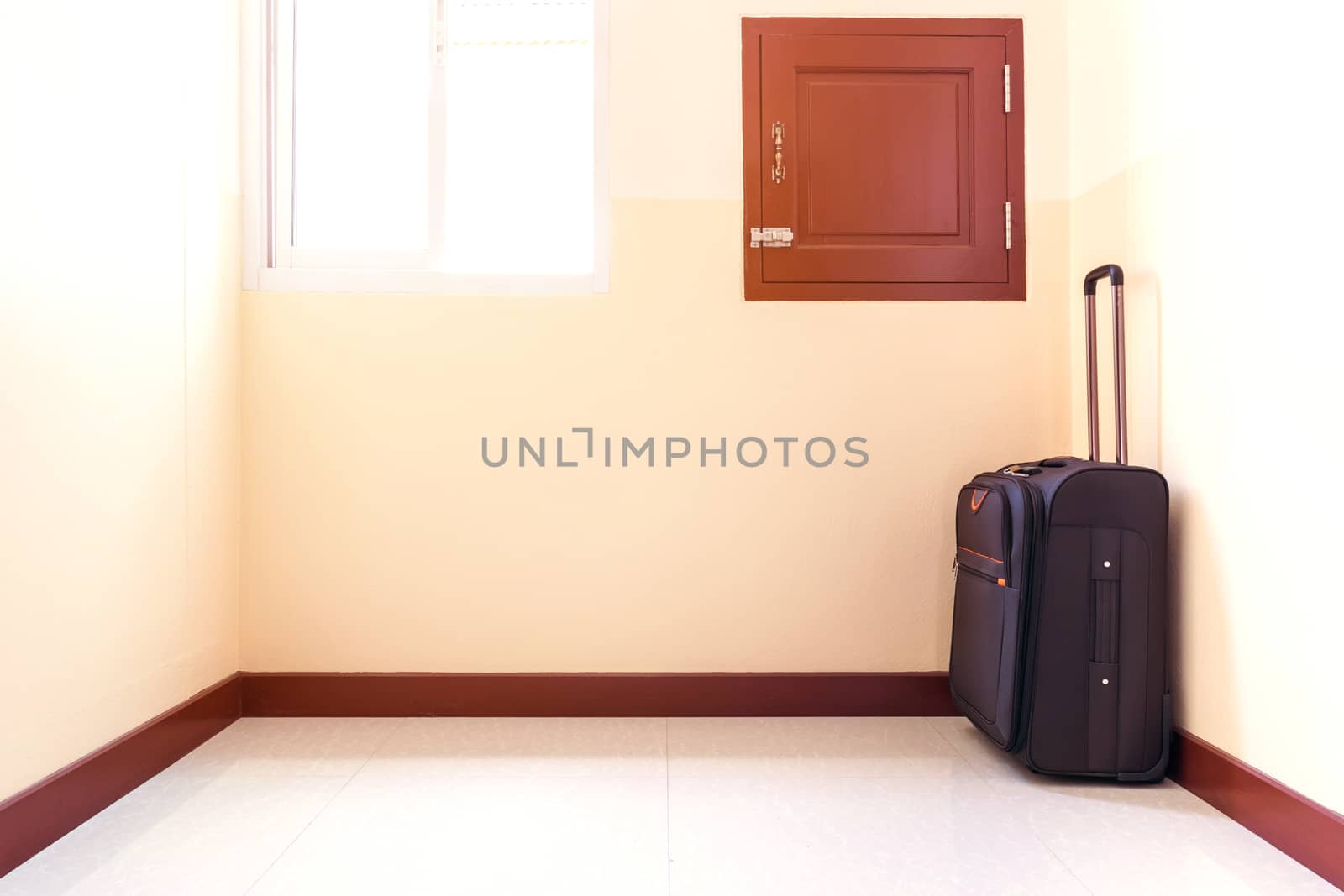 Luggage trolley was placed in the corner of the room.