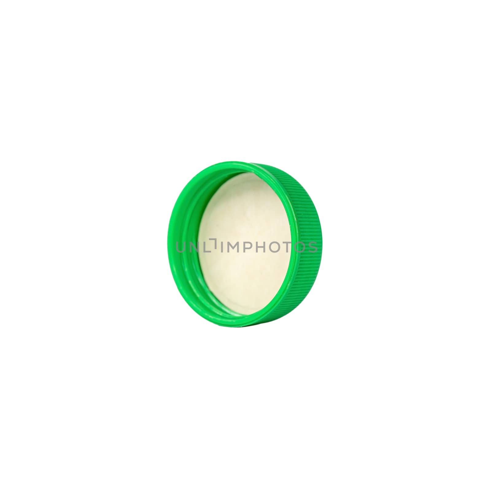 Green plastic bottle cap isolated on white background.