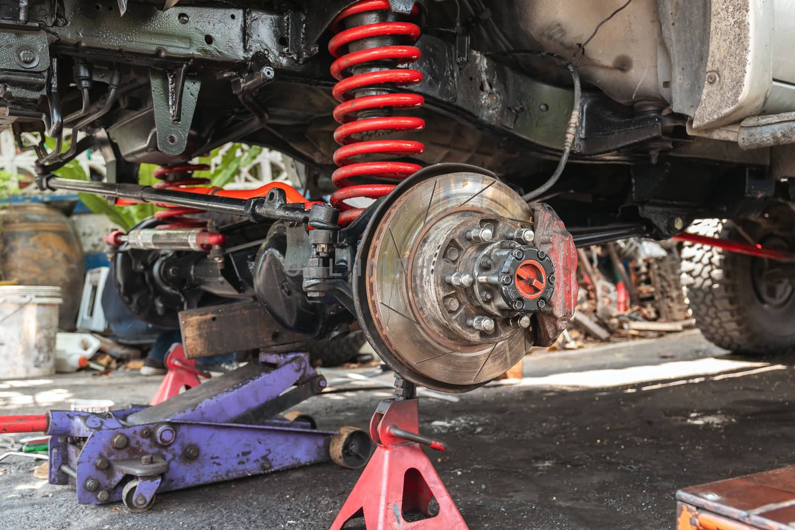 The front wheel of the car was removed to repair the brake system, Automotive industry and garage concepts.