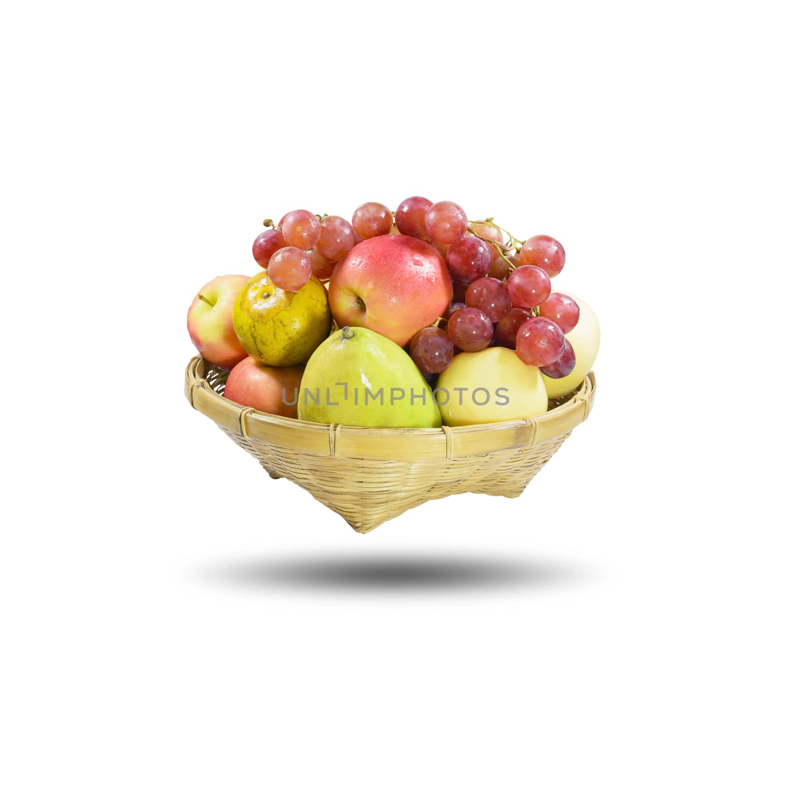 Group of many fruits in a bamboo basket isolated on white background, with clipping path.