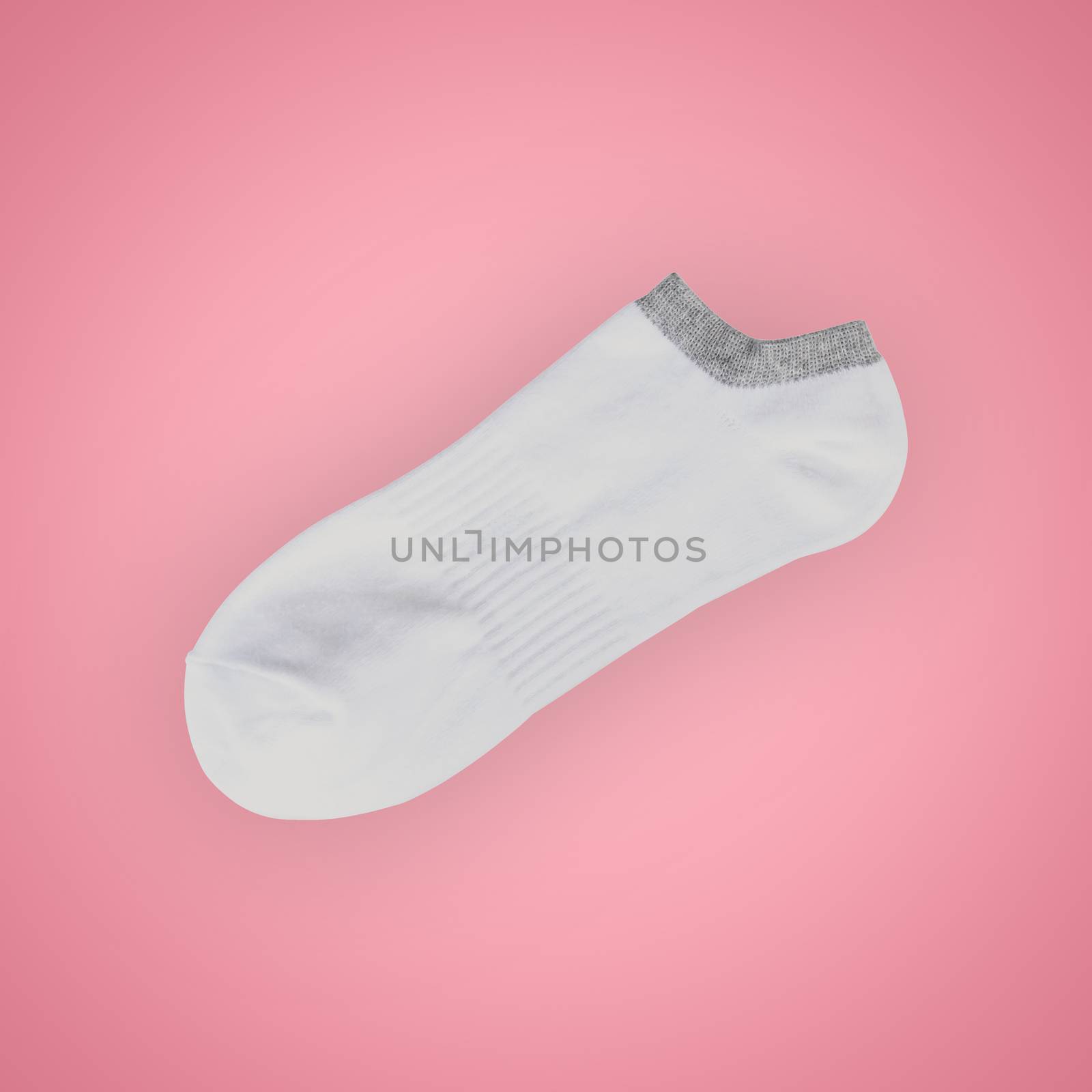 White short sport sock isolated on beautiful pastel color background, with clipping path.