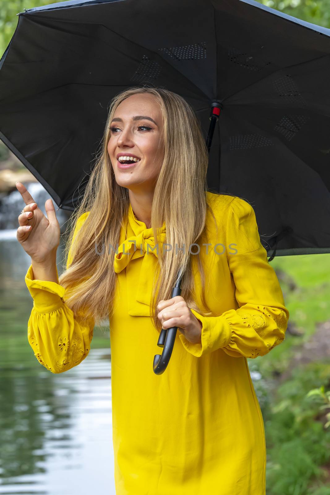 A gorgeous blonde model poses outdoors in her fall clothes